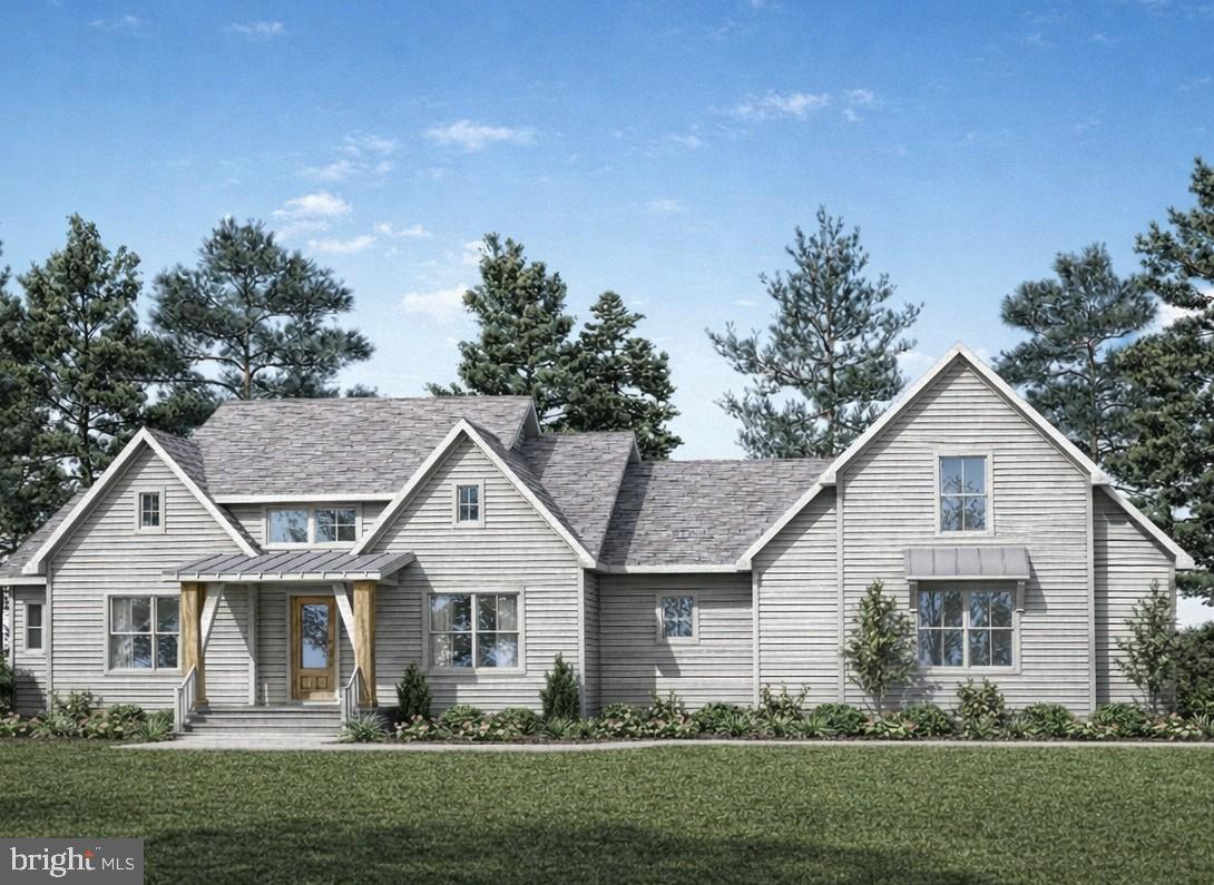 Set on a beautiful 1.57-acre homesite, this property offers the opportunity to build a thoughtfully designed Modern Farmhouse–style custom home built by Bay to Beach Builders in a setting that blends the charm of rural living with close proximity to the Indian River Bay. Located adjacent to the desirable Bluffs at Sandy Landing (without being part of the community), the property features no HOA fees and offers privacy, space, and flexibility. Just minutes from a marina and a short drive to Bethany Beach and Fenwick Island, the location is ideal for both relaxation and recreation. With ample room for a pool, pole building, or storage for your boat, camper, or other toys, this lot provides the perfect backdrop for your coastal lifestyle. The proposed Modern Farmhouse home blends timeless charm with modern functionality, offering 3–4 bedrooms, 2.5–3.5 bathrooms, and approximately 2,459 square feet. The open-concept first floor centers around a spacious Great Room that flows seamlessly into the kitchen and breakfast nook—creating a bright, inviting space for everyday living and entertaining. The kitchen features generous cabinetry, a walk-in pantry, and ample workspace, while a flexible room near the front of the home may serve as a home office, study, or optional dining room. The private primary suite is tucked away for comfort and includes a walk-in closet and en suite bath. Two additional bedrooms, each with walk-in closets, share a full bath. A convenient utility room and rear foyer enhance daily functionality. Upstairs, an unfinished bonus room provides excellent future expansion potential—ideal for a fourth bedroom, media room, or hobby space.
Exterior highlights include classic farmhouse-inspired architecture, a welcoming covered front porch, and an attached 2-car garage. The home may be customized to suit your lifestyle and preferences. To be built.  Square footage and room sizes are approximate. Options and upgrades are available.
