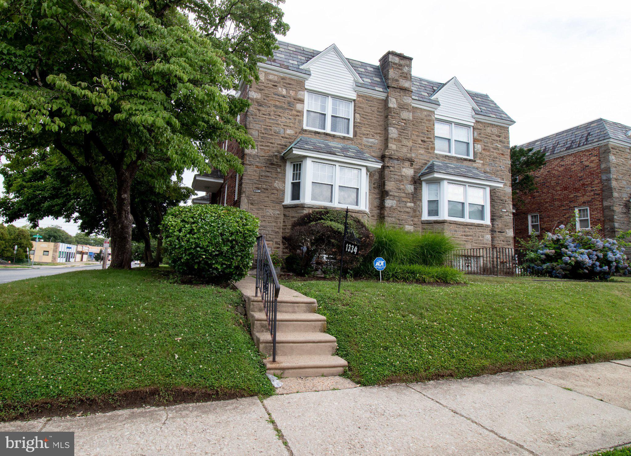 Are you looking for your urban oasis?  Look no further.  Come and check out this charming twin home in desirable Mt Airy, which offers a perfect blend of comfort and functionality.  Built in the early 1950s, this lovingly cared for residence boasts a classic, AirLite architectural style, enhanced by durable masonry construction and modern touches. Be greeted with a foyer entry with a powder room, perfect for entertaining.  Step further inside to an open, expansive and sun drenched living room.  You will instantly feel the warm and inviting atmosphere, highlighted by beautiful hardwood flooring underfoot. The heart of the home features a spacious renovated eat-in kitchen, ideal for casual meals and gatherings. Adjacent to the kitchen, the formal dining room provides an elegant space for entertaining guests.  Journey upstairs to three spacious and cozy bedrooms, including an en-suite with a walk-in shower for the roomy master bedroom and a 3-piece hall bath, with ample space for relaxation and personalization. The fully finished basement is a standout feature, providing a versatile area that can be transformed into a recreation room, home office, or additional living space. It includes powder room, storage area, garage access and an outside entrance, making it perfect for hosting out of town guests or entertaining friends and family. The attached built-in garage adds convenience, while the side entrance enhances accessibility. Bonus features are recently serviced and updated mechanicals with central air and heat!  With a total of 1840 finished square feet, this corner lot home is designed to meet your needs and provide a sense of belonging.  Minutes from Chestnut Hill shopping with grocery stores and gyms and restaurants, and very convenient to major roadways, public transportation and suburban shopping too, you have everything you need at your fingertips!  Experience the warmth and comfort of this delightful property, in a friendly neighborhood where every corner invites you to create lasting memories.  Don't miss the opportunity to make this house your home!