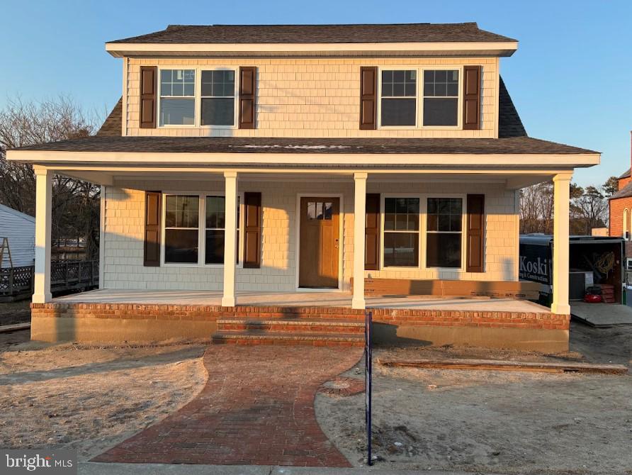 Welcome to this beautifully crafted two-story Cape Cod home, perfectly situated at the end of a quiet road in the highly sought-after town of Vienna, MD. Offering both privacy and charm, this location provides a peaceful setting while still being close to everything the area has to offer.
This thoughtfully designed home features 4 bedrooms and 2.5 bathrooms with a functional and inviting layout. The first floor offers an open-concept living and dining area, ideal for everyday living and entertaining. The kitchen flows seamlessly into the main living space and is complete with stainless steel appliances and elegant quartz countertops. A convenient half bath and a dedicated laundry and mudroom add to the home’s practicality.
The primary suite is located on the first floor and includes spacious walk-in closets and a private en-suite bathroom featuring a quartz-topped vanity and a beautifully tiled walk-in shower. Upstairs, you’ll find a large family room with vaulted ceilings, creating a warm and inviting second living space. Three generously sized bedrooms, each with walk-in closets, along with a full bathroom featuring a tub/shower combination and quartz countertops, complete the upper level. Additional highlights include oak tread stairs, a welcoming front porch with brick row lock detailing and brick steps, as well as a back and side stoop for added convenience.
This home is currently under construction. Get in early and have the opportunity to select some custom finishes and make it your own. Builder is offering a one-year home warranty for added peace of mind.

**Photos attached are of a previously built home of the same floor plan and are for layout and reference purposes only. The exterior photo shown is a model home and not the exact home being constructed at this address. Additional photos will be added as construction progresses.**