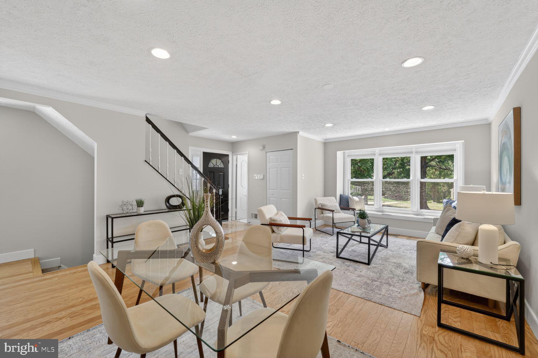 ***Open Sun 6/7 11-1 PM ***This highly sought-after corner end unit offers over 1,700 square feet of beautifully finished living space across three levels, bathed in natural light from every angle.

Step inside to an open main level with a seamless flow, perfect for entertaining. The engineered hardwood floors gleam underfoot, and a cozy wood-burning fireplace sets the tone for relaxed evenings.  A renovated eat in kitchen creates a welcoming space for both relaxation and entertaining. The well-appointed kitchen features Corian countertops, modern stainless steel appliances, and ample maple cabinet space, making meal preparation a breeze. Whether you're hosting a dinner party or enjoying a casual meal with loved ones, this kitchen is sure to impress.  The open plan living and dining area boasts three windows and recessed lighting and a fun window seat. The marble powder room adds a touch of elegance.

Upstairs, the spacious primary suite is a serene retreat featuring a renovated ensuite bathroom with stylish marble tile. Two additional well-sized bedrooms and a renovated hall bath provide plenty of room for family or guests. An airy landing with an oversized linen closet and attic access complete the upper level.

Head to the lower level, where you’ll find a fully finished recreation room with new carpeting, abundant storage, and a rough-in for an additional full bath—ideal for future customization! Outside, enjoy the large newly refinished deck and a fully fenced oversized yard with new sod, perfect for outdoor gatherings or quiet mornings with coffee.

Nestled in the popular Rolling Forest community, amenities abound, including a tot lot/playground and optional neighborhood pool membership. Nature lovers will appreciate the wooded privacy, walking trails, and proximity to West Springfield Village Park and Pohick Creek Stream Valley Park.

Commuters will rejoice with easy access to I-395, I-95, Fairfax County Parkway, and the Franconia-Springfield Metro. Plus, you’re just minutes from abundant shopping, dining, and entertainment options in West Springfield, Springfield, and Kingstowne, including Giant, Costco, Wegmans, and Home Depot.

This home truly offers the perfect blend of comfort, convenience, and community. Freshly painted, prepped & staged for the most discerning buyer—don’t miss your chance to make it yours!