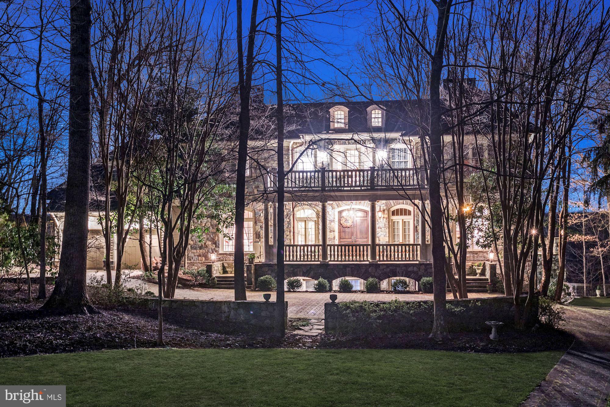 A stunning Jim Rill Masterpiece in one of the most sought after neighborhoods in Potomac.  Merry Go Round Farm is a unique neighborhood with an equestrian  center and beautiful walking trails situated along the Potomac River.  Breathtaking views of the Potomac River and Virginia are the hallmarks of this signature custom home in Merry Go Round Farm. Thoughtfully designed by Jim Rill and custom built by Potomac Valley Builders with every attention to detail possible. Arrive via the paved drive to the welcoming front porch.  Enter through double doors into the gracious entry foyer full of southern charm. Views from the foyer through the living room and screened porch and are filled with breathtaking scenery.   Eleven foot ceilings, stunning wide plank custom wood floors, custom molding and transoms abound.  The outstanding millwork in this home is unsurpassed. The main level floorplan includes a  grand entry foyer with circular staircase, a spacious living room leading to French doors which open onto the screen porch. On the right side of the home you will find a magnificent cherrywood library with fireplace and a corner atrium sunroom with views across the Potomac to Virginia. The left side of the home offers a grand dining room, fabulous gourmet eat-in kitchen, family room with fireplace, potting room, and laundry.   The  back staircase off the kitchen leads to the upper and lower levels. Doors from all rooms at the back of the house open onto a gas-lit flagstone patio. Every room flows seamlessly throughout.  The sweeping circular staircase with skylight leads you up to the bedroom level with 10 foot ceilings. The upper level offers a complete master suite with sitting room and elegant bath. 5 additional bedrooms with four baths and a second laundry and balcony complete the second level. The back staircase guides you to the lower level double recreation room with tray ceilings, wet bar, wine cellar, exercise room and guest room with full bath and covered patio. An incredible bonus on this level includes a den with fireplace, a heated auto workshop and a second two car garage. Multiple doors lead to the covered patio, swimming pool and pool bath. Finishing touches to this exquisite home include double garages for a total of 4 car garage parking, an elevator to all three stories, and charming gas lights around the exterior of the home.  Simply breathtaking and in turn key condition.