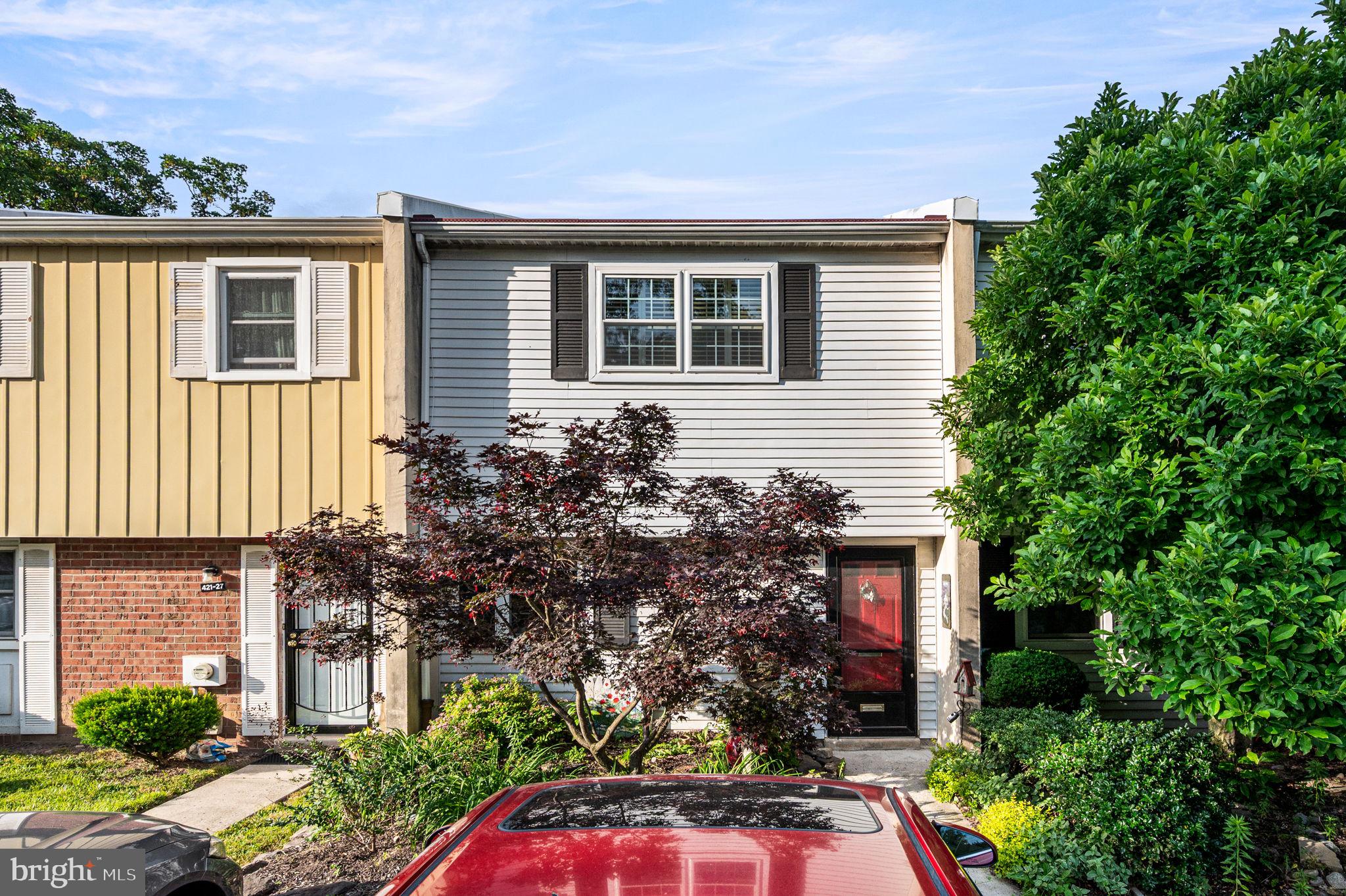Rare opportunity to own in the highly sought-after School House Lane Village, a private community offering a peaceful enclave with convenient access to the best of the area. This well-cared-for townhome presents a wonderful opportunity for a buyer looking to add their personal touches and create their ideal home.
The main level features an open floor plan with a comfortable flow between the living and dining areas, a cozy fireplace, and sliding glass doors leading to a private garden patio. The outdoor space includes a unique mural created by a renowned local artist, adding character and charm to the home. A convenient half bath is also located on the first floor.  Upstairs, you’ll find two spacious bedrooms, each featuring custom-designed closet systems, along with a full bathroom and the convenience of second-floor laundry. Additional highlights include central air, reserved lot parking, and the privacy of a tucked-away community setting. Ideally located near major routes, local universities, public transportation, shopping, and dining, this home offers a rare opportunity to enjoy a private community lifestyle while bringing your own vision and updates to make it truly your own.