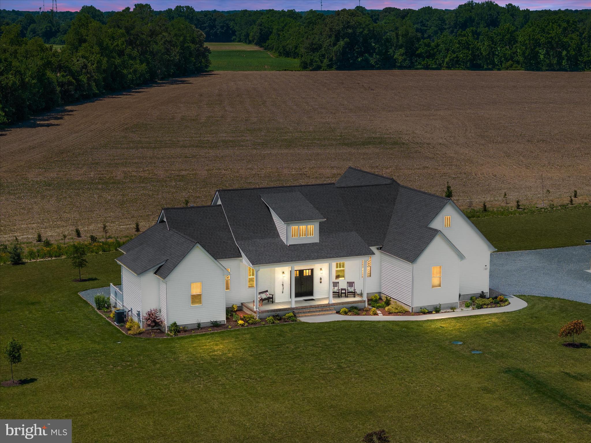 Coming Soon and OPEN HOUSE Saturday June 6th 10AM-12PM** Searching for a property that truly stands out? This fully upgraded custom designed home offers the perfect blend of luxury and privacy. From the moment you turn onto the driveway, you'll already be in love! Greeted by a long gravel driveway, oversized parking area and breathtaking curb appeal that only gets better as you head to your grand entrance front covered porch. Set on a large lot with thoughtfully planted trees for future privacy, rows of whimsical wildflowers, scenic farmland views and extensive landscaping, the setting feels both peaceful and refined. Inside, the wide open floorplan is anchored by a stunning gas fireplace that creates a warm focal point for the main living space, while the oversized kitchen island is perfect for everyday dining or weekend entertaining. A butler’s pantry provides exceptional storage for appliances and kitchen essentials, and the luxurious primary suite features an elevated bathroom and enormous walk in closet that conveniently wraps around to the main level laundry room. Just beyond the main living area, the attached three seasons room showcases floor to ceiling glass views, creating the perfect space to enjoy the Eastern Shore of Maryland’s changing seasons in year round comfort. Downstairs, the unfinished basement with a walk out staircase offers endless potential for future living space, recreation or storage, while the detached building with its own electric meter, concrete pad and covered lean to adds incredible flexibility for hobbies, equipment or workshop space. More details and professional pictures to follow!