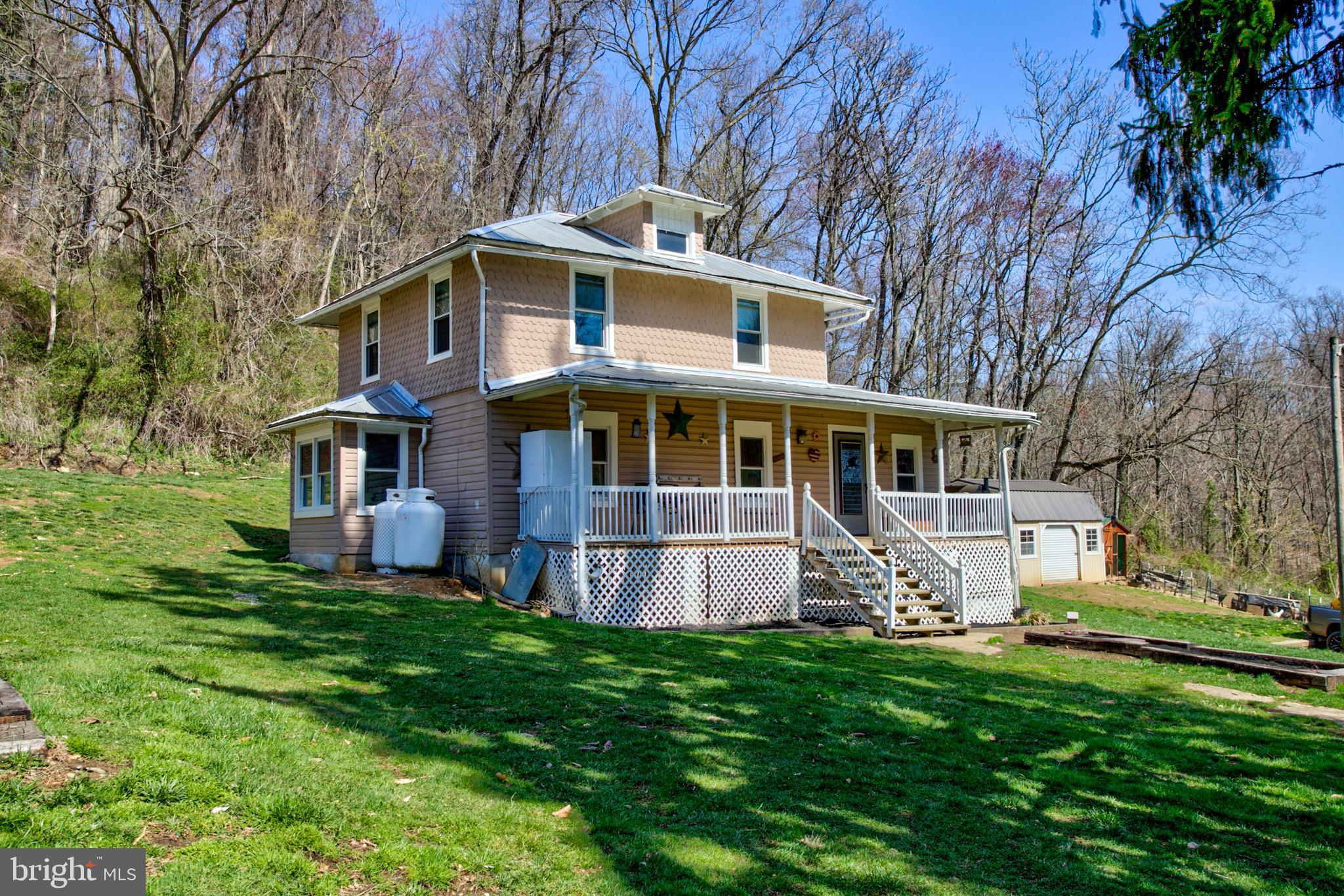 If you are looking for remote privacy, this home has it. No visible neighbors in this property which is situated on just shy of 1.5 acres. Located in Martic Twp. in Penn Manor Schools. The home offers 3 bedrooms, 1.5 baths featuring a main level bedroom with private entry way! The kitchen offers vaulted ceilings, a counter area for seating eat-at and additional counterspace. The kitchen opens to the dining are offering an open concept. A large family room off the dining area offers great space for entertaining or family gathering. Two additional bedrooms located on the second floor! The large lot offers great space for recreation, entertaining and use and enjoyment! ALL MAJOR MECHANICALS ARE NEW! The windows, roof, furnace, well pump, septic system, water heater and A/C are all less than 4 years old!