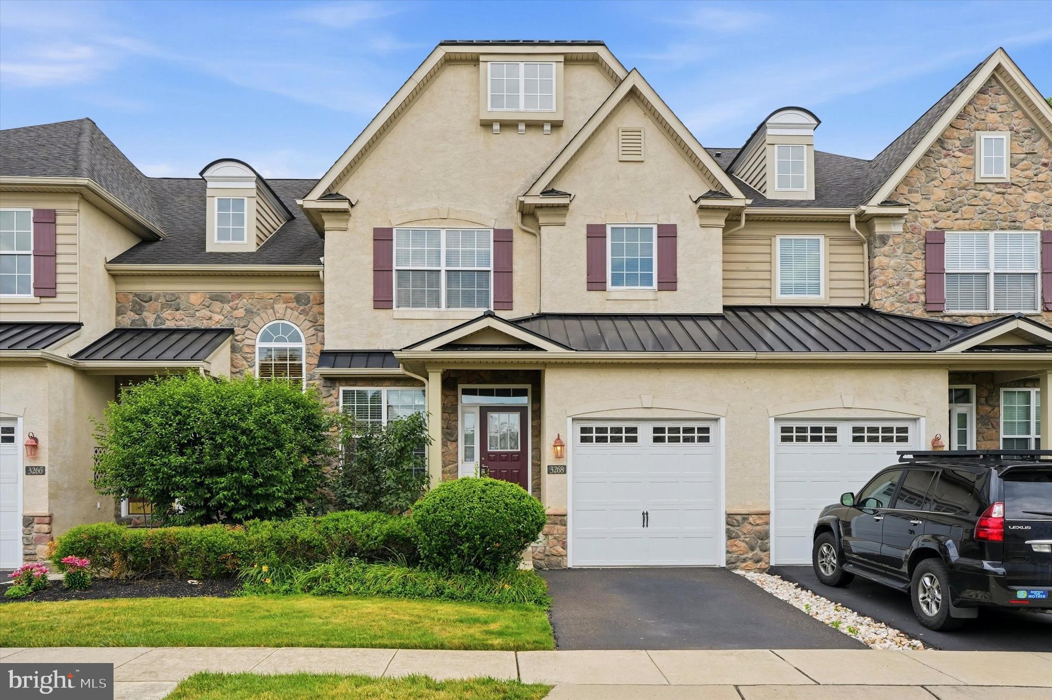 Welcome to 3268 Waterstone Ct in the desirable Townhomes at Heritage in Buckingham Township! This well-maintained townhome is ideally situated on a quiet cul-de-sac with peaceful wooded views and is within walking distance of the community clubhouse, outdoor swimming pool, and tennis court. This spacious home features 9ft ceiling on the main floor, 3 bedrooms, 2 full and 2 half bathrooms with the open floor plan offers hardwood flooring throughout the main level, recessed lighting in the kitchen, and a bright living room filled with natural light.  There is a separate dining room with a beautiful chandelier, leading to the kitchen, equipped with stainless steel appliances, double wall ovens, built-in gas cooktop, built-in microwave, granite countertops, a double sink, and opens to a sunny breakfast area with access to the deck overlooking the trees.  The finished walk-out lower level provides additional living space with a wall of windows, gas fireplace, half bathroom, and sliding doors leading to the backyard—ideal for family entertaining, a recreation room, or a gathering after dinners.  The laundry is located in the lower level.  Upstairs, the spacious primary suite features a walk-in closet and private bath with dual vanities, soaking jacuzzi tub and separate stall shower, while two additional bedrooms offer generous space and natural light with a shared hall full bath.  Conveniently located in the award winning Central Bucks School District, just minutes from Doylestown Borough, Peddler's Village, shopping, dining, and major routes including 202, 611, and the Pennsylvania Turnpike. This home offers a perfect combination of comfort, convenience, and low-maintenance living.