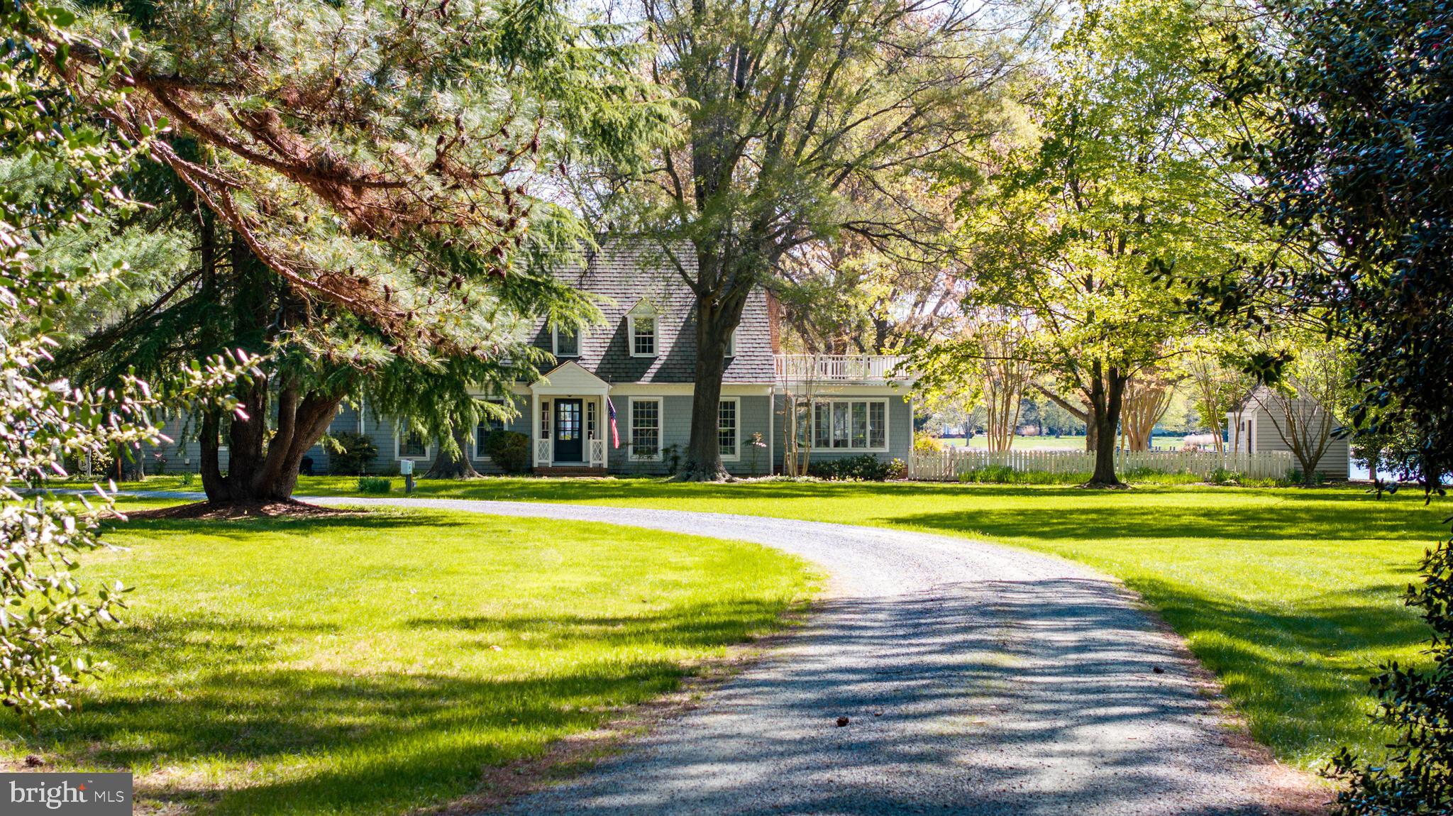 Welcome to this Cape Cod-style waterfront home nestled on 4.3+/- serene acres just 3 miles from the heart of Oxford. With 6 bedrooms, 4 full bathrooms, and a half bath, this spacious residence offers comfortable living and stunning water views from most rooms. Set along the peaceful Bringman Cove off Island Creek, the property boasts a private dock with 6+ ft MLW, a rip-rapped shoreline, and expansive waterfrontage—perfect for boating or simply enjoying the view. Inside, the home features hardwood flooring throughout, three gas fireplaces, built-in bookcases in multiple rooms, and sun-filled living spaces with a thoughtfully designed layout ideal for entertaining. The sunroom opens to an in-ground pool overlooking the water, creating a seamless indoor-outdoor living experience. Additional highlights include a 2-car attached garage and a detached garage that serves perfectly as extra storage or a workshop. This exceptional property combines privacy, comfort, and classic Eastern Shore charm—all within minutes of Oxford’s shops, restaurants, and marina. A rare opportunity to own a true waterfront retreat.