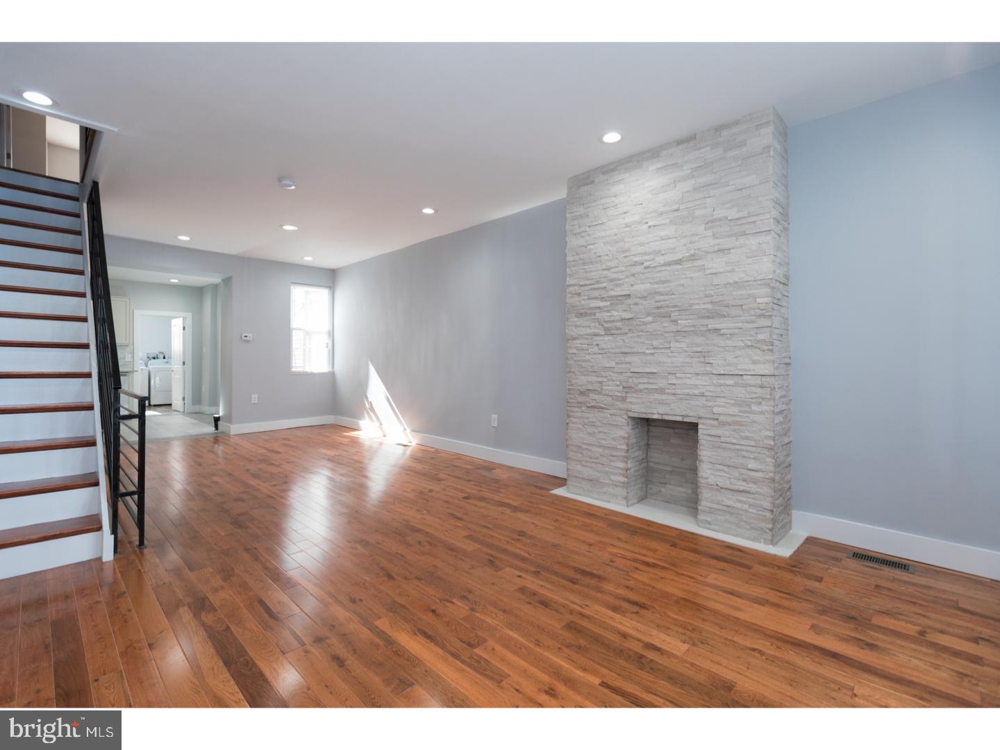 Welcome home to 2909 Memphis st, a gorgeously renovated 3 bed, 2 full bath Port Richmond row with great curb appeal in a rapidly up-and-coming section of the neighborhood. When walking up to the home you will immediately notice the charm of the beautifully restored facade and front porch. Enter the first floor into the open concept living and dining area with great natural light, tall ceilings, recessed lighting, hardwood flooring, and handsomely crafted decorative fireplace - making this an amazing entertaining space. The luxurious kitchen is highlighted by perfectly paired solid wood cabinetry and quartz counter-tops, stainless appliance package, and custom tiled floors and backsplash. Off the rear of the main level you will find a spacious full bath with glass enclosed shower and ultra convenient first floor laundry area along with access to the large rear patio - ideal for summer get-togethers. Upstairs you will find 3 bedrooms all with ample closet space, hardwood floors, and good natural light as well as full hall bath with soaking tub. The finished basement could be used in a variey of ways and includes tiled floors, utility sink, mechanical closet, and plenty of storage space. Centrally located, close to parks, public transportation, major roadways, and shopping. We welcome your visit today!