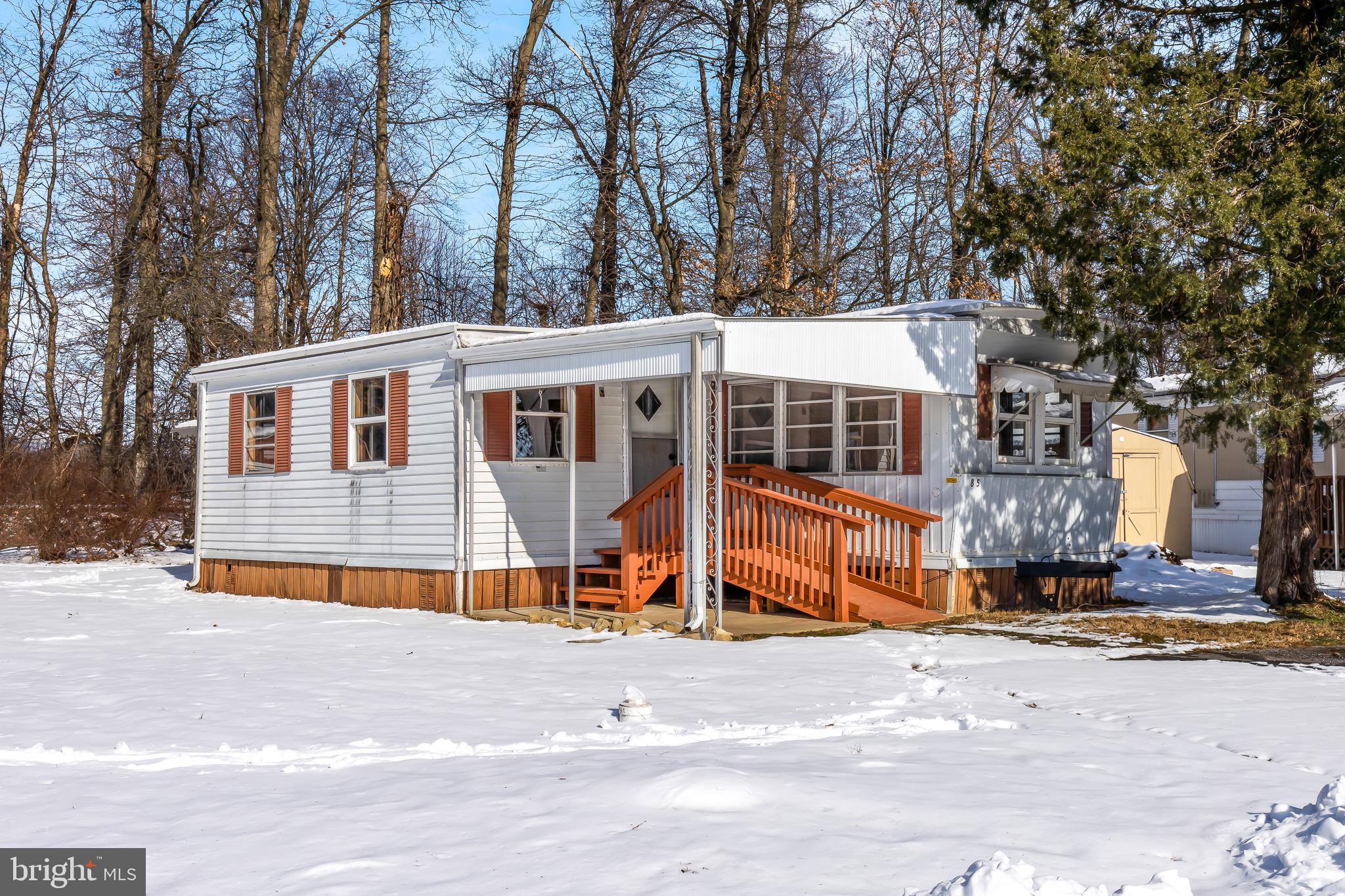 Don't miss the opportunity to make this clean and cozy mobile home yours.  Crossland Homes 10x55 ft. single wide with a side addition that creates a spacious living area, remodeled bathroom in 2022, 15x20 ft open porch, plus a handicapped accessible ramp right to the front door.  Buyer must be approved by Mobile Home Park and is responsible for obtaining their application and community rules/regulations, as well as pet restrictions from Penn Valley Village Property Mgmt, Inc..  Home being Sold As-Is.  Schedule a tour and MAKE YOUR OFFER!