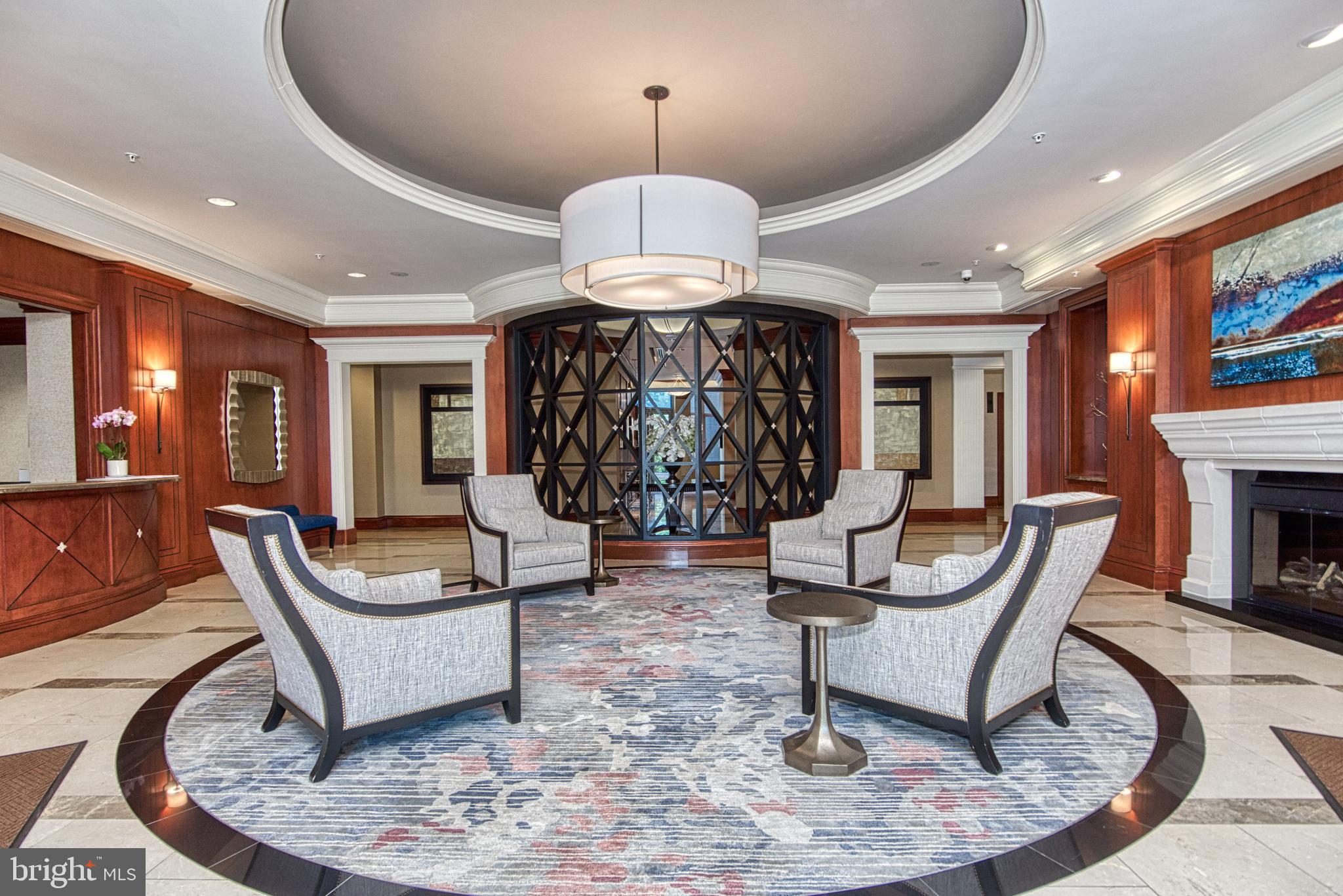 Fantastic opportunity to reside at Premiere Address in the heart of Tysons. Luxurious high rise with amenities including rooftop pool, Concierge, Guest suites availability, Party room, Fitness center, Library and more. 
Incredibly well appointed unit with an expansive view on the 13th floor and garage parking.  Master suite with a spa-like bath, huge walk in closet, and a den with double french doors for multiple uses, such as an office or guest bedroom.
Additional full bathroom makes this unit feel almost like a 2 bedroom, 2 full bathroom. Gleaming wood floors, gourmet kitchen with extensive maple cabinet spaces, granite countertops, and stainless steel appliances. Stacked windows to fully enjoy the amazing view, you can step outside to your private balcony with a custom screen door to even further enjoy that grand view.  Metro silver line, Tysons corner mall, I-495, and the toll road makes a commute to DC a breeze.