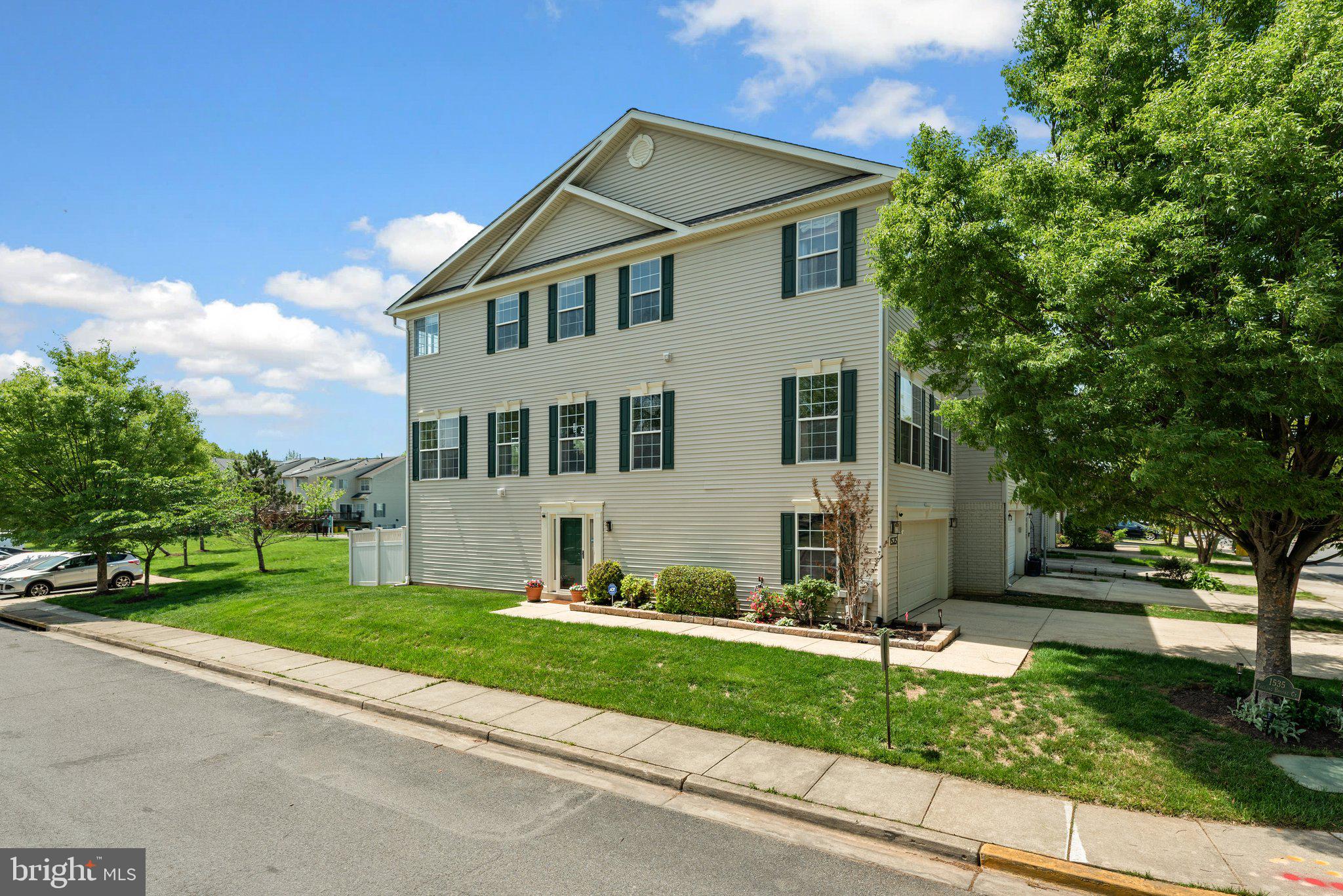 PRICE REDUCTION!  This exceptional end-unit townhome offers the perfect blend of style, space, and functionality.   With a rare and desirable side entry and an abundance of windows on three sides, the home is filled with natural light and exudes the feel of a single-family residence.  The unique corner placement also provides extra privacy, enhanced curb appeal, and scenic outdoor views that set this home apart, and the two-car garage offers the ultimate in convenience.  Inside, the entry level features a thoughtfully designed full bath, private office or flexible room perfect for remote work or guest space, and a generous recreation area ideal for gaming, fitness or relaxing.  From here, step outside to your fully fenced backyard and patio.  The upper  main living level offers a perfect balance of modern comfort and style, beginning with a convenient half bath and warm engineered hardwood floors that flow through the spacious living room with loads of windows.  The kitchen is well appointed and features rich, hardwood flooring, stainless steel appliances, granite countertops, ample cabinetry, and a generous center island with overhang seating—perfect for casual dining, meal prep, or gathering with guests.  A large window above the sink offers picturesque views of the composite deck and open green space beyond.  Enjoy even more living space in the sunroom just off the kitchen, where a cozy gas fireplace adds warmth and charm. From here, step out onto the low-maintenance composite deck.  Upstairs, you'll find two spacious secondary bedrooms, a full hall bath with a tub/shower combo, and a convenient laundry closet.  The owner’s suite features two walk-in closets and en-suite bath with a corner soaking tub, separate glass-enclosed shower, and dual vanities—offering the perfect retreat at the end of the day.  Enjoy all of the community amenities Seven Oaks has to offer including outdoor pools, community centers, fitness centers, basketball court, tennis courts, pickleball courts, numerous tot lots/playgrounds, bicycle playground and fitness trail, and much more!  Community is also ideally located in a prime location close to shopping, dining, Ft. Meade, NSA, and commuter routes, along with the Odenton MARC train station.