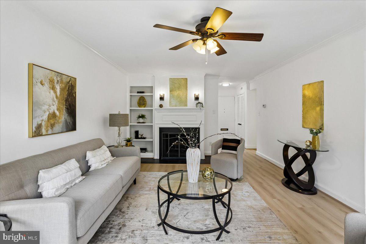 Nestled at the end of a serene cul-de-sac within the Pooks Hill Condominium, this thoughtfully renovated, three-level townhome offers a blend of sophisticated indoor living and private outdoor spaces. As you step inside, beautiful new oak vinyl plank flooring guides you to a spacious living room, anchored by a cozy fireplace with elegant built-in shelving, where waves of natural light pour through sliding glass doors and seamlessly flow onto the first of two full-width rear balconies—perfect for seamless indoor-outdoor entertaining. 

The adjacent dining area connects beautifully to the upgraded kitchen, which features updated countertops, stainless steel appliances, under-cabinet lighting, and a charming breakfast nook that opens directly onto a private, fenced front garden patio.

A floating staircase leads to the upper level, where the primary bedroom suite serves as a relaxing retreat with its own top-level balcony and sitting area. A generous second bedroom features a Juliet balcony and extensive built-in shelving, served by a hallway bath with a deep soaking tub.

The fully finished lower level offers incredible versatility, complete with a cozy family room that opens to a private rear garden patio, the home's third bedroom, with quick access to a full bathroom, along with a convenient kitchenette featuring a cooktop, refrigerator, and ample cabinetry—an ideal setup for an au-pair suite, multi-generational living, or long-term guests.

Outdoor enthusiasts will appreciate being just a two-block stroll from tennis courts, playgrounds, and fields at Maplewood/Alta Vista Local Park, with the expansive trail networks of Rock Creek Park just a short ride away. Commuters will love the effortless access to two nearby Metro stations and major thoroughfares, while world-class entertainment at The Music Center at Strathmore and the vibrant boutique dining and upscale shopping of downtown Bethesda are all just minutes from your front door.