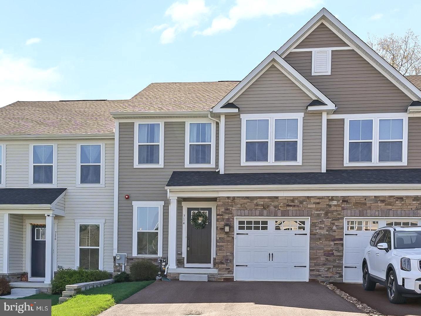NEW PRICE! Welcome to 714 Cascade Way in desirable Longwood Preserve! This beautiful 3 BR / 2.5 BA townhome with a finished basement offers modern living in an unbeatable location—just minutes to Kennett Square Borough, Longwood Gardens, Route 1, and a wide variety of shopping and dining options.

Built in 2021 and meticulously maintained, this home truly feels like new! Upon entry, you’ll immediately appreciate the open-concept layout, upgraded LVP flooring throughout the main level, and oversized windows that fill the home with natural light.

The heart of the home is the spacious kitchen and family room area—perfect for everyday living and entertaining. The kitchen features upgraded cabinetry, quartz countertops, subway tile backsplash, stainless steel appliances with gas cooking, double oven, and a large center island. The adjoining breakfast area provides great views of the rear yard and access to the composite deck with privacy fencing.

The kitchen flows seamlessly into the inviting family room, complete with a cozy gas fireplace—ideal for relaxing evenings at home. An added bonus is the upgraded noise-reducing insulation for enhanced comfort. A conveniently located powder room and access to the attached garage complete the main level.

Upstairs, you’ll find an oversized primary suite featuring a vaulted ceiling, spacious walk-in closet, and a well-appointed en-suite bath with tile shower and double vanity. Two additional bedrooms with great natural light, a hall bath, and a laundry room with sink round out the upper level.

The finished basement provides excellent additional living space—perfect for entertaining, a home gym, or hobby area.

Longwood Preserve offers a thoughtfully designed community with walking trails, a tot lot, and guest parking. Commuting is a breeze with easy access to Philadelphia, West Chester, and Delaware.

Don’t miss your opportunity to make this exceptional home yours—schedule your showing today!