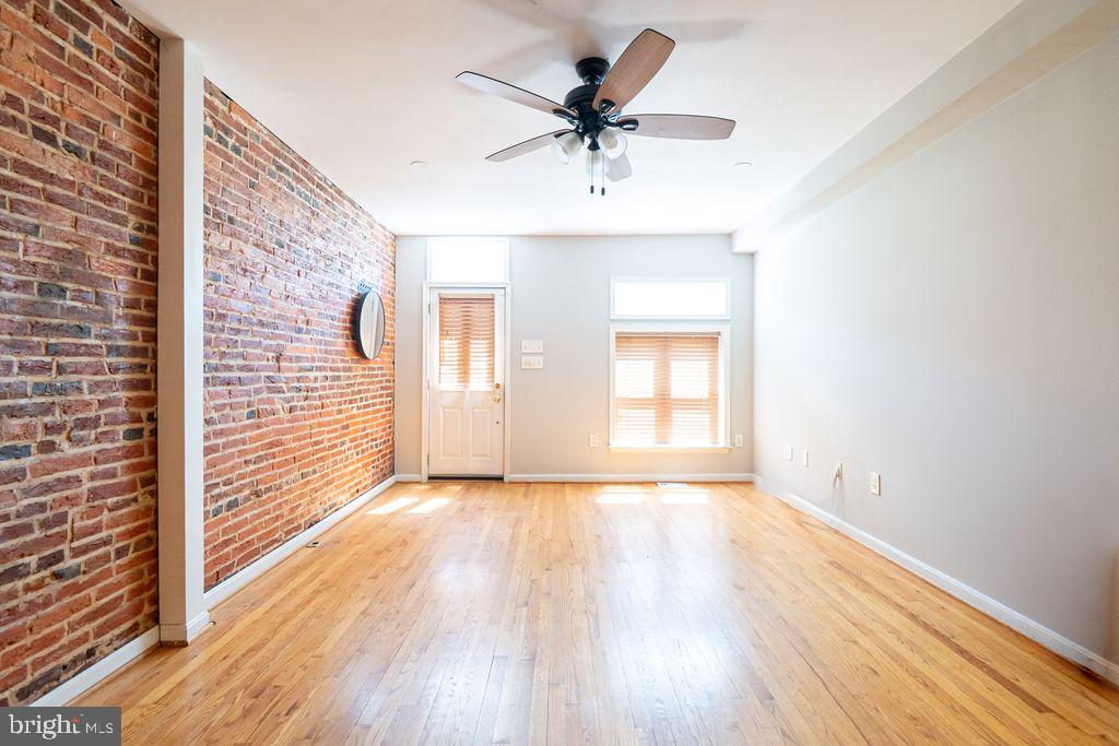 Spacious modern home located in the heart of Fells Point.  This 3 bedrooms 2 1/2 baths home has lots of charm and character throughout. Hardwood floors, exposed brick, stainless steel appliances. A large kitchen with island, space for a table and plenty of storage, first floor half bath, first floor office. Upper level offers 3 great size rooms with large closets and baths,  and laundry room with storage.
Finally, the finished basement would be a great additional space for a 2nd office, or entertainment area. 
Let's not forget the beautiful views of the city from 2 story rooftop deck. 
City living at it's finest!