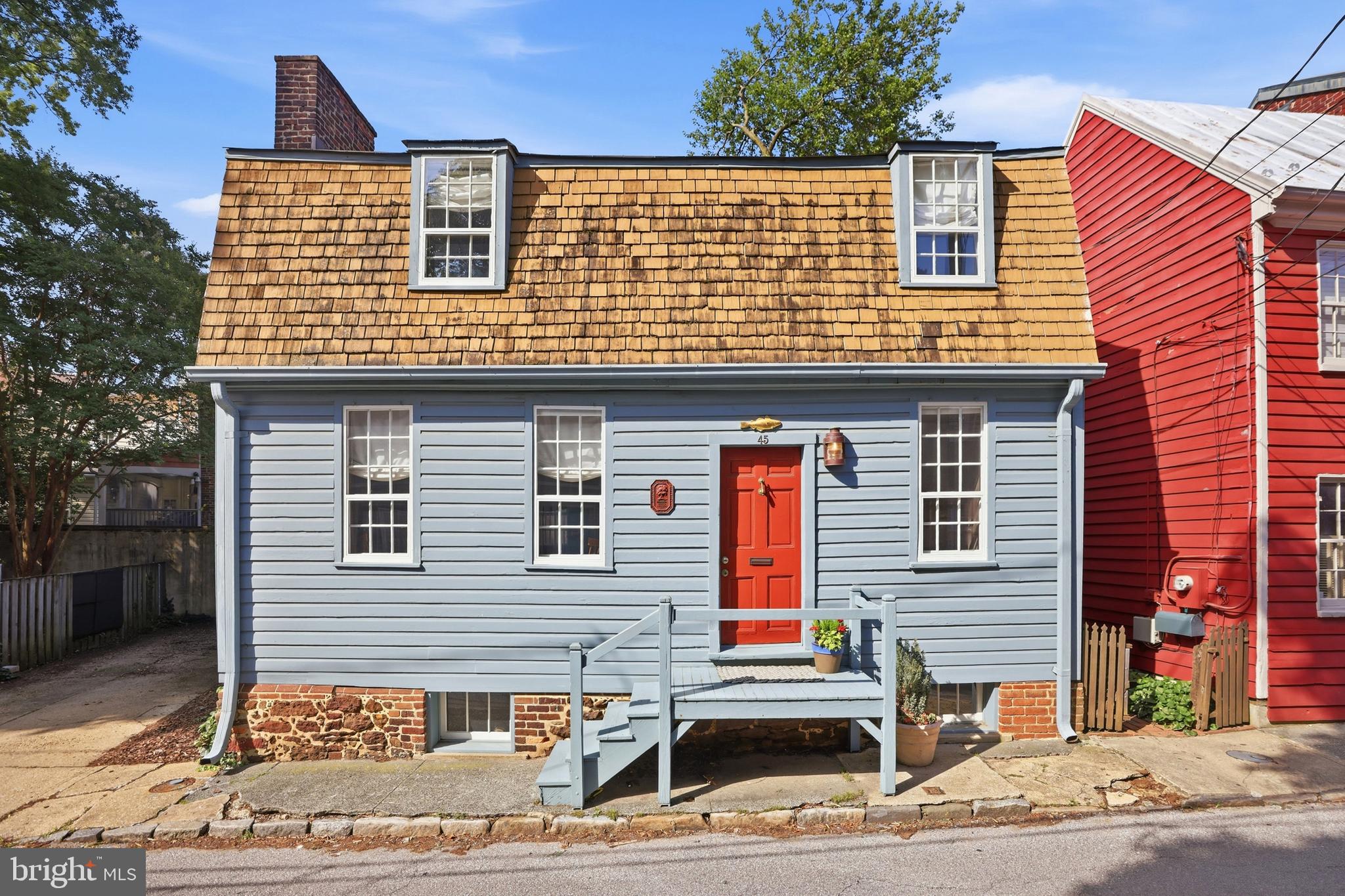A rare opportunity to own one of Annapolis' most distinguished historic residences, thoughtfully restored to preserve its extraordinary heritage while seamlessly incorporating today's finest amenities. This remarkable 18th-century Tidewater Georgian Vernacular home is a recipient of the 2017 Historic Annapolis Preservation Award, is listed on the National Register of Historic Places, and offers the uncommon combination of rich history, exceptional craftsmanship, private off-street parking for two vehicles, and a spacious fenced backyard.

Originally constructed before the founding of the United States, the property sits at the foot of the hill from the Maryland State House and just steps from City Dock, in the heart of Historic Annapolis. The land was originally set aside for Francis Nicholson, whose visionary 1694–1695 plan established the layout of Maryland's capital city.

Every detail of the restoration was carefully executed to honor the home's original character while enhancing everyday livability. Historic architectural elements have been meticulously preserved, complemented by premium modern upgrades throughout. The beautifully designed gourmet kitchen features top-of-the-line appliances, abundant custom cabinetry, generous storage, and a discreetly integrated laundry area, making it equally suited for everyday living and elegant entertaining.

Inside, light-filled, generously proportioned rooms showcase timeless architectural details, three fireplaces, and the warmth and craftsmanship that only a home of this pedigree can offer. The seamless blend of original materials, thoughtful restoration, and sophisticated modern conveniences creates a residence that is as comfortable as it is historically significant.

Offering a truly unparalleled Historic Annapolis lifestyle, this is an exceptional opportunity to own an award-winning piece of American history in one of the country's most coveted waterfront communities.