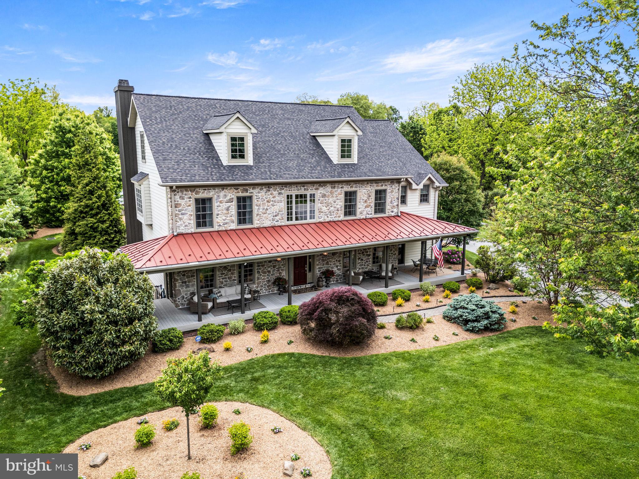 Welcome to 1548 Morstein Rd. Beautifully custom and truly one
of a kind, this exceptional residence is designed for those who
value character, space, and thoughtful design details —far from
cookie-cutter in both layout and lifestyle. With over 6,000 square
feet across three floors, the home features hardwood floors,
generous room sizes, high ceilings, and large windows.
The main level offers an effortless blend of elegance and comfort.
A bright and cheerful great room features a wood burning
fireplace and abundant light from the oversized windows. The
kitchen is truly the heart of the home, thoughtfully planned and
beautifully appointed with granite countertops, travertine
backsplash, a Wolf 4-burner cooktop with 24in s/s griddle, pot
filler, double ovens, built in refrigerator & freezer, center island
and wrap around countertop with seating for 6. There is also a
cheerful morning/sunroom adjacent to the kitchen & overlooking
the grounds and patio at the back of the house. A “friends
entrance” from the breezeway/driveway boasts an expansive
mudroom and entry with slate flooring and coat closet adding to
everyday convenience. Off the mudroom is a generous home
office area which can also be converted to a first floor guest suite
if desired. The home is thoughtfully designed so that an elevator
could easily be installed in the future. The 2nd floor of the house
features a stunning primary suite with a luxurious primary bath
with french doors to a private balcony and walk in shower. The
primary suite includes 2 walk-in closets and a spacious dressing
area. Additional bedrooms include one with an en-suite Bath and
walk in closet, and two more with walk in closets and a well-
appointed Hall Bath with jacuzzi tub and separate water closet.
The laundry room is conveniently located on this level attached to
the built-in desk area, with stair access to a newly finished third
floor. This level offers a large bonus room and full bath —ideal for
a music studio, art studio, game room or whatever you choose!
Outdoor entertaining is exceptional featuring lush landscaping
and a fabulous front porch perfect for lazy summer days and
relaxing. The back of the house provides outdoor living at its
finest with a fenced backyard, expansive hardscape patio, firepit
area and room to play and relax!
Car enthusiasts will appreciate five garage bays: three attached
and two in a detached garage. The over-sized attached garage
offers a work area, dedicated electric car charging port and a
walk-up loft space ready to be customized. New roof in 2025!  Ideally located in the
award-winning Great Valley School District, just minutes to
downtown Malvern & downtown West Chester, and close to
everywhere you want to be - offering easy access to the PA
Turnpike, train station, shopping, restaurants and parks.