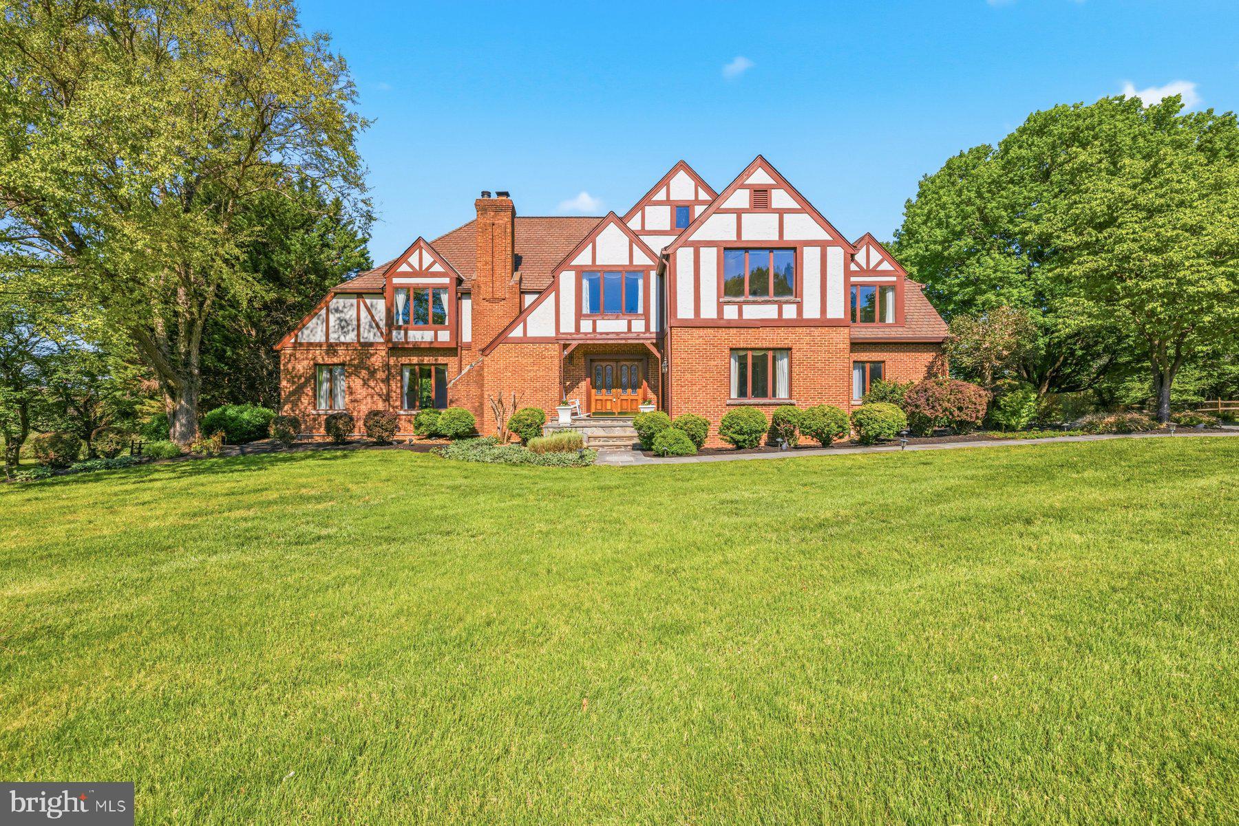 Price Improvement + Major Updates Completed! Brand-New Carrier HVAC Installed & Professionally Maintained Pool. Tucked within prestigious Bridle Crossing in North Potomac, this custom Tudor estate rests on 2+ scenic acres surrounded by mature landscaping, open green space, and equestrian trails, offering exceptional privacy and timeless estate charm. Step inside the dramatic two-story foyer, where soaring ceilings, elegant millwork, oversized windows, and rich wood flooring create an immediate sense of space and sophistication. Designed for both grand entertaining and comfortable everyday living, the home features a breathtaking two-story family room with a floor-to-ceiling stone fireplace, walls of windows, built-in beverage station with dual wine refrigerators, custom chandelier, and sun-filled morning room with direct deck access. The beautifully renovated kitchen (2023) showcases upgraded cabinetry, new countertops, premium Bosch appliances, center island, and seamless flow into the breakfast area and family room. A main-level bedroom suite with adjacent full bath and separate private office offers exceptional flexibility. Upstairs, the expansive primary suite serves as a peaceful private retreat featuring soaring ceilings, hardwood flooring, gas fireplace, sitting area, oversized windows overlooking the picturesque grounds, and two walk-in closets. The spacious en suite bath is filled with natural light from multiple skylights and includes dual vanities, soaking tub, and separate shower. The upper level also features three additional spacious bedrooms, 3 full baths, walk-in closets, and a convenient laundry room, all connected by dramatic open-to-below hallways that enhance the home’s airy architectural design and natural light. The fully finished walk-out lower level expands the home’s living and entertaining possibilities with an enormous recreation room, dedicated media room, exercise room with sauna, full bath, guest bedroom, and multiple flexible-use spaces .  The outdoor setting is truly spectacular: Expansive deck overlooking the in-ground pool, sprawling open grounds, and serene wooded backdrop, an ideal setting for entertaining, recreation, gardening, quiet relaxation, or simply enjoying the ever-changing beauty of nature: Spring brings spectacular blooming ornamental trees reminiscent of cherry blossoms, summers are filled with lush greenery and glowing sunset views, autumn showcases vibrant foliage, and winter transforms the property into a peaceful snow-covered sanctuary.
Beyond its beauty, the home has benefited from substantial recent infrastructure investments rarely seen in resale properties. An extensive whole-house plumbing project exceeding $35K was recently completed with full WSSC permitting and inspections under current construction codes, including replacement of all polybutylene plumbing, updated systems to new energy-efficiency requirements, hot-water recirculation,  and modern temperature safety features. Additional upgrades include a brand new Carrier HVAC (serving the basement/main level); a new well pressure tank, new 75-gallon water heater, upstairs Carrier gas HVAC system (2022), whole-house well water treatment and softening system (2023) and Hayward Pro Series pool filtration system (2023), providing exceptional long-term value and peace of mind. Additional highlights include 3 fireplace, hardwood flooring throughout all three levels, feshly painted interior, spacious three-car garage. Located in the highly sought-after Wootton High School cluster, this exceptional residence offers peaceful estate living with remarkable convenience to Kentlands, Downtown Crown, Rio, Potomac Village, shopping, dining, scenic Potomac Bridle & Hiking Trails, North Potomac Community Recreation Center, Big Pines Local Park, and easy access to I-270 and I-495.
