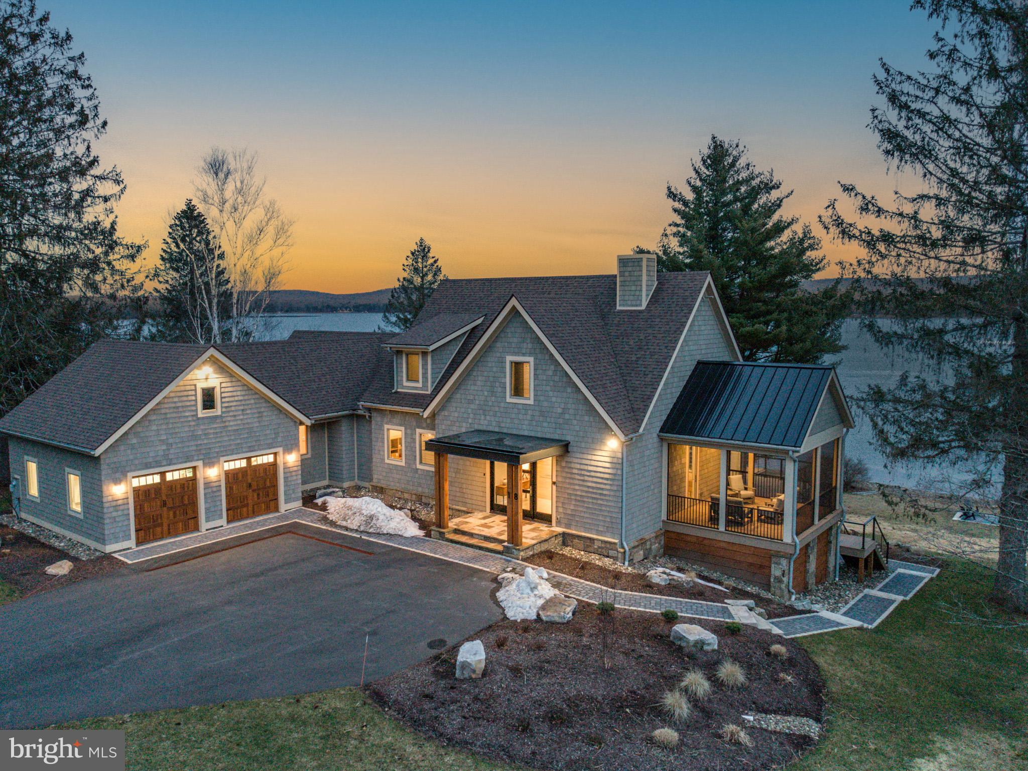 Unbelievable opportunity in the prestigious Reserve at Holy Cross. This home has one of the most unimpeded views of the water in Deep Creek without any dense tree lines. Thoughtfully designed to capture the expansive lake views from every room, bringing a sense of ease and tranquility the moment you step inside. Don Nemith Builders just completed this exceptional chic and stylish modern lakefront home 18 months ago! Drive down the curved driveway lined with majestic pines to the 6 Bedrooms, 4.5 baths located on a quiet cul-de-sac. Add 217’ of gently sloping shoreline and impressive outdoor areas and it is everything you could ask for. Conveniently located just a short drive to the ski slopes and area restaurants. The home is being sold furnished with boat dock included. Why wait to build when you can buy this practically new, exceptionally maintained home on one of the best spots on the Lake?