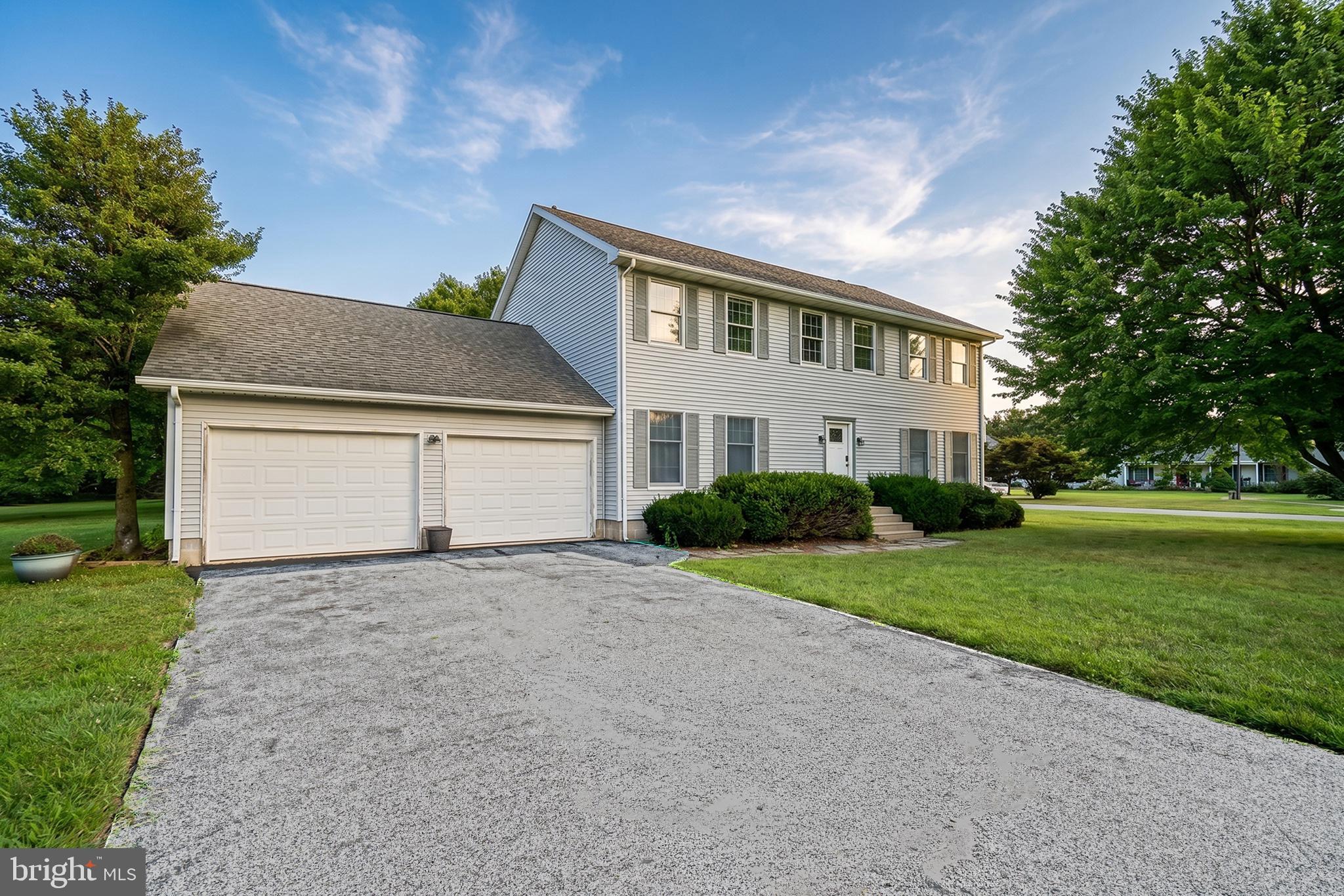 FANTASTIC VALUE IN REHOBOTH BEACH! This expansive and beautifully situated 4-bedroom, 2.5-bathroom colonial offers an incredible opportunity in an established Rehoboth Beach community just off Old Landing Road. Boasting a grand 2,804 square feet of finished living space on a premier, generously sized lot, this property perfectly balances a private neighborhood feel with effortless convenience. Avoid the heavy traffic with fast, easy access to Route 1, putting you just minutes from dipping your toes in the ocean at Rehoboth Beach, exploring historical downtown Lewes, or shopping at the outlets.  Inside, the main level features an open, airy layout built for effortless entertaining. The living room serves as the heart of the home, transitioning seamlessly into a cozy country kitchen is complete with warm wood cabinetry, and an attached formal dining room.  Main floor conveniences are rounded out by a dedicated mudroom/laundry area, a half-bath, and a massive 2-car garage offering ample storage for all your beach toys and vehicles.  Upstairs, the home continues to impress with its remarkably spacious layout. The primary suite stretches an has a spacious perfect footprint for a private sitting area, home office, or media nook alongside an en-suite bath and a large walk-in closet. The three additional guest bedrooms ensure family and visitors never feel cramped, all sharing a central hall bath. Outside, the rare, park-like yard is adorned with mature shade trees and partial fencing, providing a vast expanse of green grass for pets, play, or gardening. Opportunities to own a home of this scale at this price on such a generous lot so close to both Lewes and Rehoboth beaches are few and far between. Schedule your showing  today!