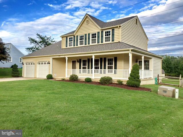 Welcome Home! Fall in love with the wrap around porch or many upgrades throughout!  Open floor plan is perfect for entertaining. Kitchen overlooks family room w/FP....Formal DR & Living Rm w/gleaming hdwd floors. Upper lvl boasts Mstr Ste w/cathedral ceilings and private balcony & mstr bath w/tub & sep shower. Fenced in backyard is perfect for any get together! This one won't last long!