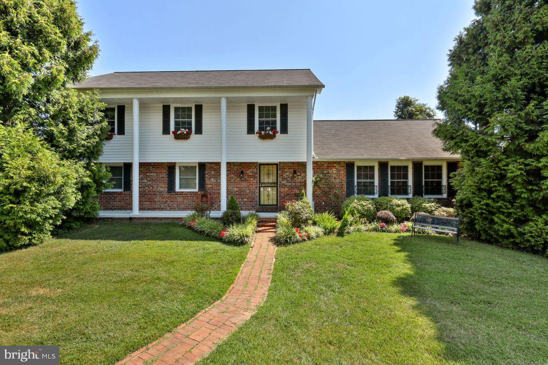 This home features a wide variety of options that will check all the boxes you have wanted in a home. It starts with a park-like setting on almost an acre in that backs to trees offering privacy. Beautiful landscaping abounds with grapes, fruit trees and flowers.  Inside, There are numerous spacious rooms to fill all of your family and entertainment needs. First floor even has an extra room that can be used as a home office or mud room. Huge 2 story addition further  enhances the many options that are available in this home already. Wet bar in the basement, Hardwood floor on both 1st and 2nd floors. Renovated master bath 2020 & kitchen in 2018. Lots of added features such as instant hot, touch faucet and luxury vinyl tile with pewter grout.