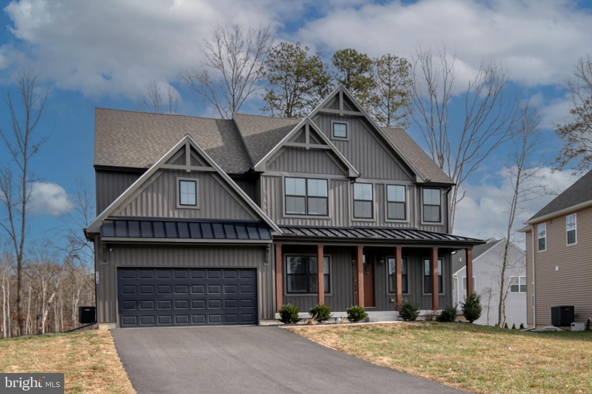 From the moment you pull up, this home just feels special. 
 
This nearly new Parker Model in the sought-after Cool Springs community blends modern design with warmth and character in a way that’s hard to find. Thoughtfully customized in collaboration with a professional interior designer, every detail was chosen to feel intentional, stylish, and livable. 
 
The exterior immediately sets the tone with moody board-and-batten siding, black vinyl windows, wood columns, metal roof accents, and an oversized 8-foot front door that makes a statement before you even step inside. Once you do, you’ll notice the 9-foot ceilings, extra recessed lighting, and a layout that flows beautifully while still offering distinct, usable spaces. 
 
Just off the entry, a charming home office sits to one side—perfect for remote work or quiet reading—while an inviting living room on the other feels ideal for cozy evenings or hosting guests. Moving further in, the heart of the home opens up into a spacious family room with a gas fireplace, seamlessly connected to a cook’s kitchen designed for real life. You’ll love the upgraded appliances, gas range with vent hood, Corian countertops, large center island, and an impressive walk-in pantry. This open living and dining space is where everyday moments happen—meals, conversations, and memories. 
 
Upstairs, the primary suite is a true retreat. It’s generously sized yet cozy, highlighted by elegant picture-frame molding in a rich forest green. The spa-like ensuite bath features a standalone soaking tub, a large walk-in shower, dual vanities, and a spacious walk-in closet—your own private escape at the end of the day. Three additional bedrooms are nicely sized and share a full bath, offering flexibility for guests, kids, or hobbies. 
 
The full, unfinished basement adds even more potential, with a poured concrete foundation, an egress window, and a rough-in for a three-piece bathroom. Whether you envision a future finished space, home gym, or recreation area, the groundwork is already in place. 
 
Set in a peaceful rural pocket of Cecil County, this home offers the best of both worlds—quiet surroundings with easy access to everything. You’re just about an hour from both Philadelphia and Baltimore, making commuting or weekend trips a breeze. 
 
This isn’t just a house—it’s a home that was thoughtfully designed, gently lived in, and ready for its next chapter.