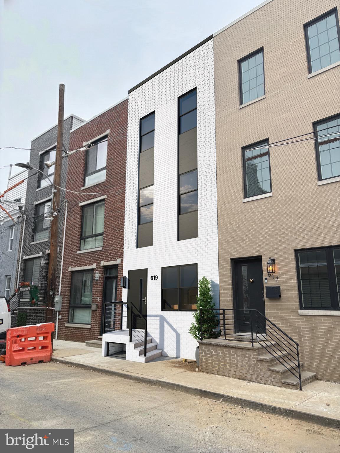 Welcome to this newly constructed row home offering modern and comfortable living. Located in the vibrant Lower Moyamensing neighborhood of South Philadelphia, enjoy close proximity to parks like Mifflin Square Park and Marconi Plaza, as well as a variety of local restaurants, cafes, and bakeries. The home is also minutes from East Passyunk Avenue's bustling dining and shopping scene. Situated on a quiet street with convenient access to public transportation, shopping, parks, and major roadways, this property provides both functionality and convenience. The open-concept main level features a bright living area, dining space, and a contemporary kitchen with ample counter space, a center island, and modern finishes throughout. The second floor includes two versatile bedrooms or office spaces, a full bathroom, and a dedicated laundry area. The third level is dedicated to a spacious primary suite with a walk-in closet, and a private bathroom featuring a large shower and sleek finishes. Above the third floor is the rooftop deck—an ideal setting for relaxing or entertaining. A fully finished lower level expands the living space even further, offering a recreation or family room, an additional bedroom, and a full bathroom. This new construction property offers a generous layout, modern upgrades, and plenty of potential perfect for anyone seeking a move-in-ready home. Taxes and square footage is the responsibility of the buyer to have verified independently.