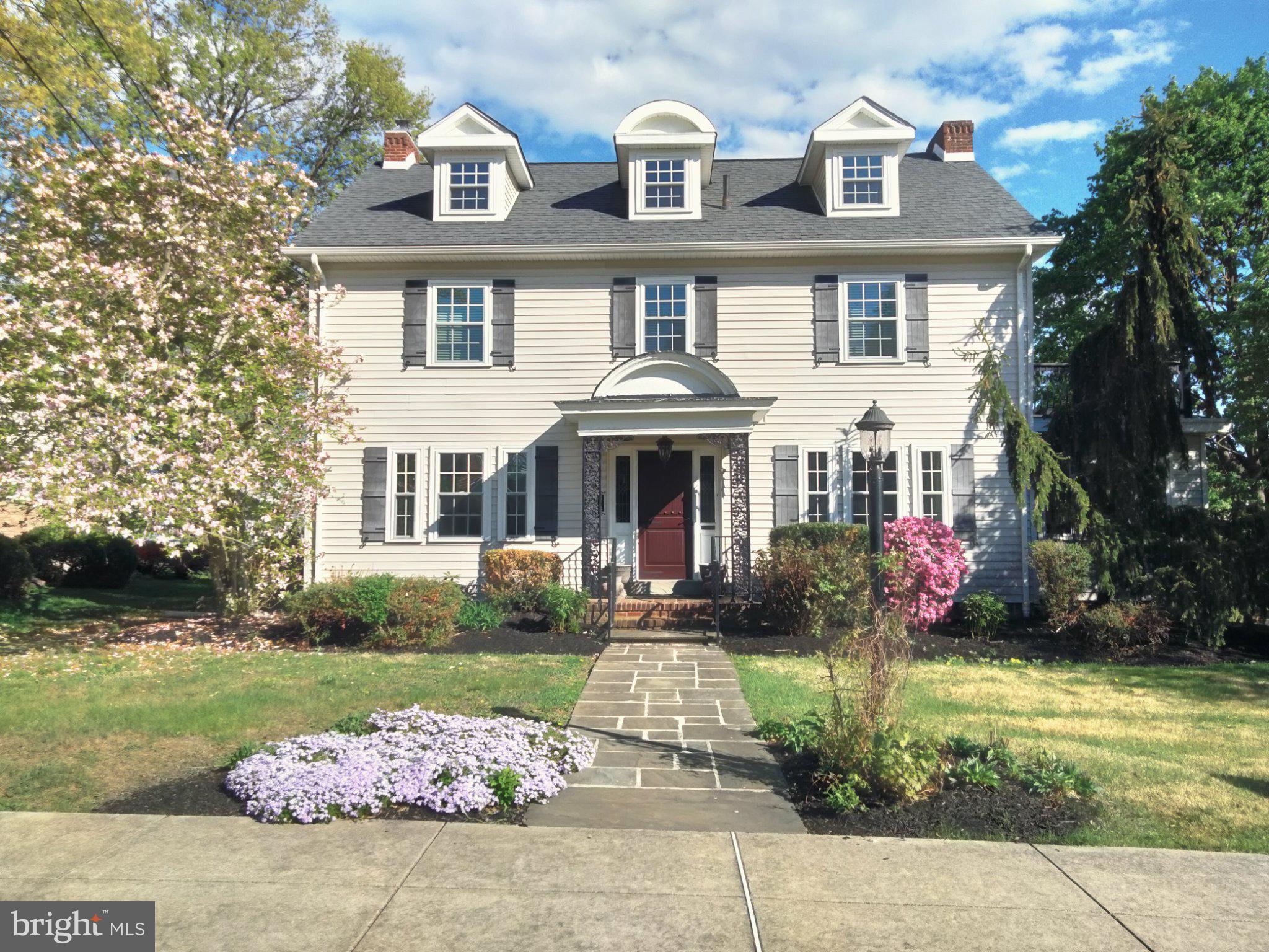 As the address implies, this home is situated in the well-known Rosedale retreat of Pottstown Borough, Montgomery County, PA. A side walk-lined street guides the visitor to an in-bloom pink Magnolia tree and flagstone walk leading to this home with a grand porch-covered and railed entry with lead glass sidelights. Inside, a sweeping staircase and inlaid wooden floors capture your attention. To one side is the living room and adjoining sunroom providing ample daylight. The living room has a genuine wood-burning fireplace bordered by Mercer tiles (Moravian Pottery & Tile Works) and 2 sets of French doors that lead to the sunroom. To the other side is a formal dining room. As you will see, crown molding and high baseboard adorn most rooms and a powder room is nestled to the side of the staircase. From the dining room easily enter the tiled kitchen w/ granite counter and stainless appliances. The kitchen leads to a breakfast nook, mudroom and basement. From mudroom, a sliding door provides access to a flagstone patio w/ half wall. From the sliding door, it’s an easy walk to your garage also. Back at the staircase, a turned set of stairs leads to a master bedroom and accompanying tiled master bathroom, tiled hall bathroom, two good-sized bedrooms and a desirable 2nd floor laundry w/ glass door. A second set of turned stairs leads to two other bedrooms on a 3rd floor ! The bedrooms have dormer windows, some eave storage and there’s even a cedar closet. The bathroom is tiled and has a period-clawed bathtub. The basement offers interior, perimeter drain protection, another laundry hookup if desired, a oil-hot water heater and outside entrance. The house is fully air-conditioned and a new roof, siding and windows were installed in 2018. A multitude of retail stores, Pottstown Hospital, The Wyndcroft School, 2 DYI centers and easy access to Rt 422 surround this quaint house and neighborhood.