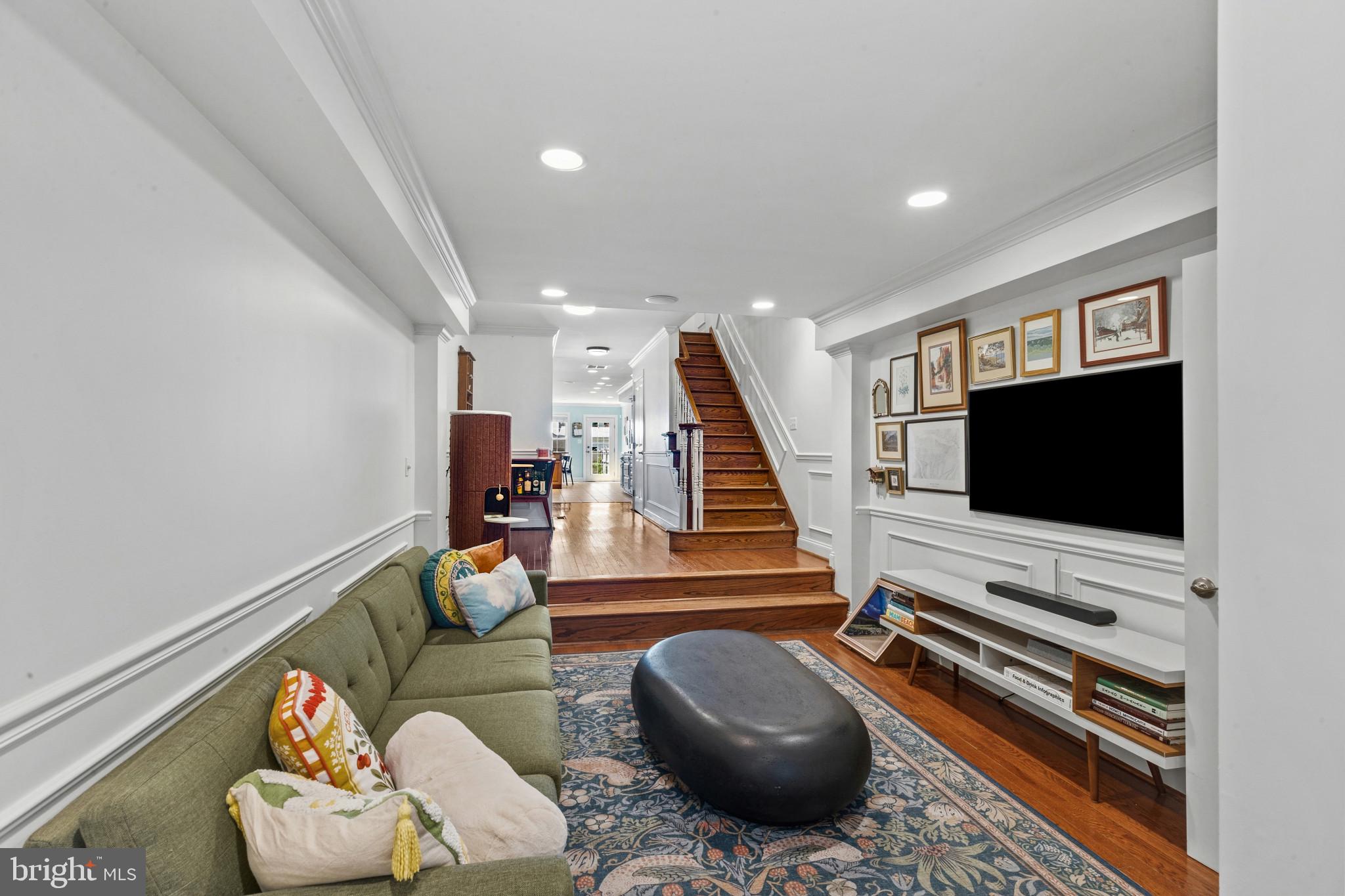 Freshly updated and exceptionally spacious, this beautifully renovated Fells Point town home offers over 2,600 square feet of finished living space with four true bedrooms, three full bathrooms, and thoughtful upgrades throughout.

Recently refreshed with fresh paint, stylish new light fixtures, a newly added foyer entry, and a brand-new water heater, this home blends modern convenience with the charm and energy of city living. With a walk score of 98, you are just moments from Fells Point’s best restaurants, coffee shops, bars, grocery stores, and waterfront attractions.

The expansive main level features over-sized living spaces, hardwood flooring, surround sound, skylights, and an open layout centered around a dramatic staircase that creates an airy feel on every level. The chef’s kitchen is designed for both entertaining and everyday living with granite counter-tops, stainless steel appliances, brand new wall oven and microwave, hooded gas range, tile back-splash, breakfast bar seating, soft-close cabinetry, and abundant prep space. The dining area opens directly to a private rear patio filled with mature plants that convey with the property, creating a peaceful outdoor retreat in the heart of the city.

Additional features include dual-zone HVAC, whole-home sound with amplifier, Cat5 wiring throughout with gigabyte switch, Schlage WiFi smart lock, Ecobee thermostats, multi-zone alarm system, generous closet space, and extensive basement storage. Built new in 2006, this home offers the square footage and modern systems rarely found in historic Fells Point.

Included with the sale are the patio shed, rear patio drip irrigation system, all blinds, TV mounts, and washer and dryer. This is the Fells Point home buyers have been waiting for!