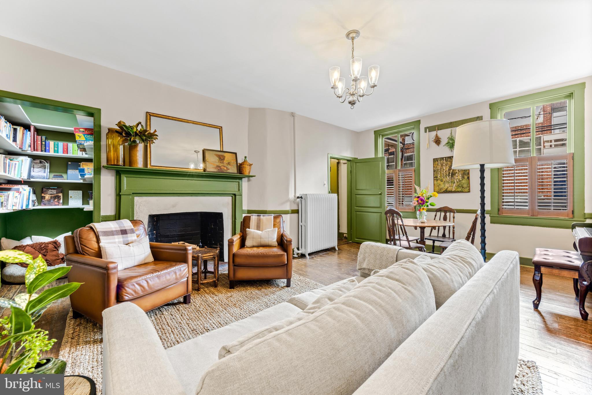 *Home is under contract with contingency - the owners are still accommodating tours!*  You know how every home boasts something is 'one of a kind' or 'once in a lifetime'? You can stop rolling your eyes... This is ACTUALLY that! Built circa 1700, The Sands House is the oldest frame house in Annapolis, cherished for centuries by one family, with more historical features retained than you can imagine, AND meets today's entertaining and lifestyle needs with an extensive and recent renovation. 

Located just a street away from City Dock, enjoy the best of downtown Annapolis' vibrant nightlife, dining, the waterfront, and the Naval Academy while retreating to a serene, quiet block. You'll love the large PARKING SPOT and private garden oasis.

You'll be transported back in time, with five original fireplace mantels, historic locks and hardware, over 100-year-old gas lantern, original glass, doors, Heart Pine floors, exposed beams, and more. The grand entertaining spaces flanking the original staircase, formal dining with the original pass-through to a stunning kitchen, and modern amenities like a main-level guest suite, multi-zone air conditioning, and mudroom built-ins make this home perfect for historical enthusiasts and today's lifestyle.

Don't miss your chance to own a piece of Annapolis history - be the next steward of The Sands House!