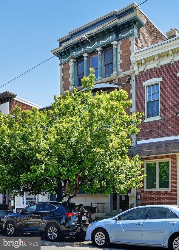 Heart of Fishtown: 2 Very Large Bi-level Apartments + Commercial 1st Floor. This is a tall, early 1900's 3-story 3,688ft. building with original decorative facade and cornice on a large 20' wide x 100' deep parcel.   1ST FLOOR:  Enter from street into vestibule. 1ST FLOOR (Commercial Space) Left side has entrance to a 1200+ sq.ft. commercial space with a private room in far front, reception area in mid-front, then multiple rooms as you head toward the rear, including a restroom and laundry area, access to basement and to a great size rear yard (plus side breezeway). 2ND and 3RD FLOORS: 2 huge bi-level apartments.  APARTMENT 2F (2ND and 3RD FLOOR FRONT) is currently set-up as 1 Bedroom (room for 2 Bedrooms), with an open kitchen/living space, wood floors, gas cooking, island cabinets & counter, great natural light, high ceilings, and huge window bay facing Girard Ave. Currently has a lower and upper living space. Bedroom is on the upper level with large full bath off the hallway, including washer and dryer.  APARTMENT 2R  (2ND and 3RD FLOOR REAR) is a very large bi-level space with 2 Bedrooms and roof access. Enter into the open living/dining/kitchen space island cabinets & counter, wood floors, high ceilings and large windows. 1st Bedroom is in the rear with 3 large windows and view to the rear yard.  There's a laundry closet off of the lower level bedroom. The second bedroom upstairs is equal size, very large - with a quiet views out to the rear yard. Full bath is on the upper level, next to stairway up to the roof. This is one of the most beautiful roof views  in Fishtown, looking out to the Delaware River and Center City.  Gas and electric are separate for all the spaces.  There's been steady reinvestment on Girard Ave and Frankford Ave in the last 15 years.  Trolley car runs down the Avenue, and this is close to the El Train with a 10 minute trip to Center City. Entrance to I-95 is down the Avenue - for direct commute to Bucks or Delaware.  **Please Do Not stop at the building or bother the 1st floor business**.