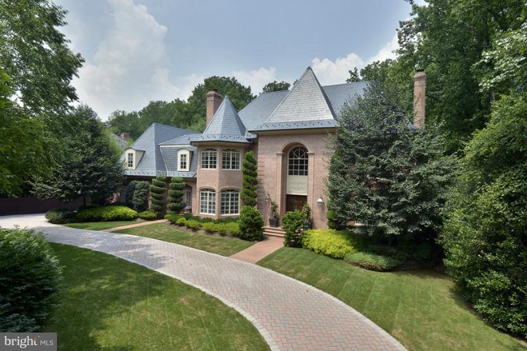 Stunning French Colonial featuring magnificent foyer, 2-story family room w/ coffered ceiling, wonderful master suite, gourmet kitchen, and superb finishes throughout.   A truly exceptional lot with stunning pool and hardscaping in Langley Forest!  Additional features include breakfast room, sun room, media room, exercise room.  4-Car Garage. A must see! .