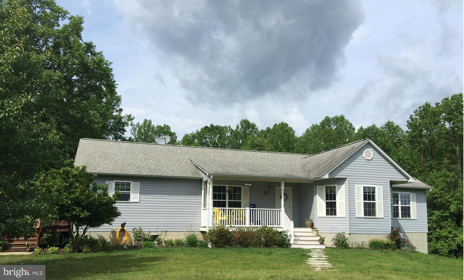 Plenty of room on over 13.5 private acres w/this HUGE rambler, mostly finished bsment w/wet bar & cabinets, great rm, playrm, full full bath. Entertain in style. Large rooms throughout. Well appointed kitchen w/island, sep dining rm w/hardwoods/BIG great room, neutral decor & lots of natural light. Bring horses/ have a big garden - lots of space. Easy commute to city, yet still country! Come & see