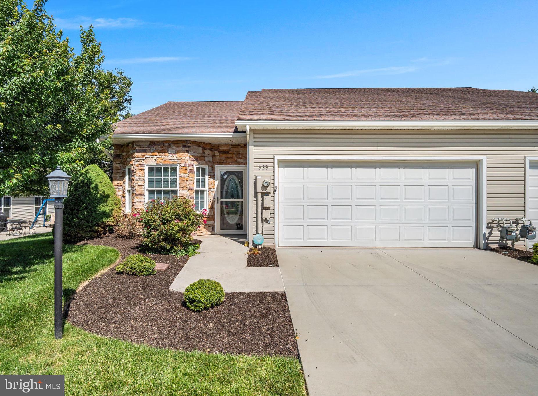 Welcome to 539 Parkview Lane in the desirable North Pointe 55+ community of Hanover. Built by its original owners in 2004 and thoughtfully upgraded throughout, this meticulously maintained home offers a rare combination of privacy, storage, and functional living space. Situated on a premium corner lot, the property features a dedicated dining room, a sought-after floor plan, and a private patio surrounded by mature trees, creating a peaceful outdoor retreat. The main level offers comfortable one-floor living with a spacious primary suite, full bathroom, laundry room, sunroom, dining room, and inviting family room. The  kitchen features hardwood flooring, upgraded cabinetry, under-cabinet lighting, stainless steel appliances, an upgraded sink, stone backsplash, and an instant hot water pump. The family room is highlighted by a custom gas fireplace, crown molding, and abundant natural light, while the sunroom provides the perfect place to relax and enjoy the tranquil setting. A rare feature within the community, the home includes a dedicated dining room, providing the ideal space for entertaining guests, hosting holiday gatherings, or enjoying everyday meals. The spacious primary suite offers exceptional storage with two closets, including a large walk-in closet and a second generously sized closet, along with custom shelving and a dedicated vanity area. A stair lift provides easy access to the second floor, where you'll find an additional bedroom, full bathroom, and a luxurious heated jetted whirlpool tub, creating the perfect private space for guests or hobbies. Additional upgrades include custom blinds and draperies, UV window tinting, a radon mitigation system, enlarged storage areas, access to a large storage space above the garage, and numerous thoughtful builder upgrades that reflect the care and attention invested in this home over the years. Rarely does a home become available that combines this level of care, privacy, storage, and quality within North Pointe. Pride of ownership is evident throughout, making this truly move-in ready home one you won't want to miss.