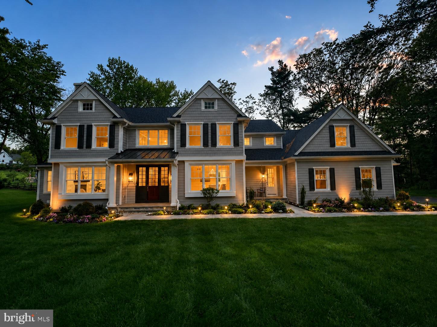 Simply put, this beautifully designed home is the finest fully completed new construction for sale on the Main Line. This Ultimate Forever Home includes a multitude of customizations and upgrades which a buyer would normally invest in over a period of many years of ownership. Just bring your suitcases! Every closet is custom outfitted. Immediately entertain with ease in a kitchen that contains four ovens, two sinks, a smart refrigerator and much more. Enter the spacious mudroom from the three car attached garage, adorned with a high-end professional grade built-in wine cellar/closet, custom built-in cubbies, and a second first floor kid-friendly powder room. This Entertainer's Dream Home has been enhanced throughout with upgraded lighting and upgraded trim, including floor to ceiling custom paneling and built-ins in the great room and primary bedroom. In addition, there is white oak wide plank engineered hardwood flooring throughout the entire first and second floors. No carpet anywhere. The primary bath is gorgeous with Carrara marble and Brizo champagne bronze hardware and fixtures. The lot is very quiet and private and has extensive plantings, outdoor lighting and an irrigation sprinkler system already installed. This property is a lush oasis with lots of trees and birds, a masterpiece awaiting one very lucky buyer.