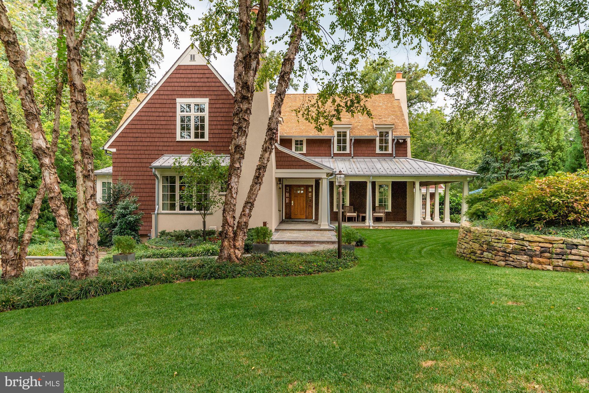 Welcome to Merry Go Round Farm and an elegant custom designed English cottage home of the highest quality. This architecturally designed floorplan of over 6,000 sq. ft. features a stone, stucco and shingle exterior with wood shake roof.  A  wonderful  covered  porch  wraps around the front and rear of the house.  The interior combines beautiful limestone and birds eye  maple floors, four  fireplaces, wonderful millwork and incredible built-in cabinetry in every room. Many rooms have wood ceilings with crossbeams with recessed lighting and built-in speakers  and  window seats  that are   warm and welcoming. The "heart" of the home is the gourmet kitchen with the highest grade stainless steel appliances, all granite countertops and a new soap stone center island. Adjacent to the kitchen is a charming breakfast room and   butler's pantry  that is conveniently located near  the  formal dining room.  The family room is also special with four sets of  french  doors with motorized shades that open to the  porch, outdoor kitchen with large Viking grill and black bottom  Pebble  Tec  Pool  area that is surrounded by well thought out English gardens. A three season sun room with outstanding views of the woods and backyard complete the first floor.  The second level  is also well thought out with three bedroom suites each with their own ensuite full bathrooms. The Primary Bedroom echoes the warmth and charm of the rest of the home with a wonderful stone fireplace, an alcove with window seats and windows, and a separate large dressing room/ closet with center island with drawers and multiple hanging areas.  The Primary bathroom has  two furniture quality vanities, custom tile designed floor,  oversized steam shower  with  multiple shower heads  and Jacuzzi bath tub.  The lower level will not disappoint.  An additional bedroom suite with ensuite full bath, multiple built-ins and  breakfast bar that can also be used as a wonderful private home  office space.  Additional highlights of the lower level include  include a professional level fitness room,  wine cellar that can be thermostatically controlled, a new 120" 4K surround sound home theater with stadium seating for six.  A new custom bar with granite counters includes a fridge and separate ice maker plus an adjacent game area with a fifth full bath. In addition to the the one car garage directly accessible from the lower level, the detached two-car is finished and is wired for a car charger, large pull down stairs for plenty of storage above and a lower level  with a semi-finished basement with its own entry. The lower level is wired for WIFI and security and includes rough-in for an additional full bathroom.  Enjoyment of the outside is enhanced by a pool house with separate half bath and changing area, stone and stucco fireplace  in addition to the pool/spa,  outdoor  kitchen and gardens. This home located on 2/.3 of an acre is one of 81 home  sites located on 204 acres.  Area residents can take advantage of the equestrian center,  the Potomac River, hiking and walking trails  with magnificent views of lakes and rolling fields. The shops and and restaurants of Potomac village are just minutes away and there is easy access to major commuter routes including I-270, I-495 and the ICC along with with airports and a nationally ranked school system. Merry Go Round Farm is an ideal neighborhood for those looking to enjoy the outdoors and live a casual relaxed lifestyle.