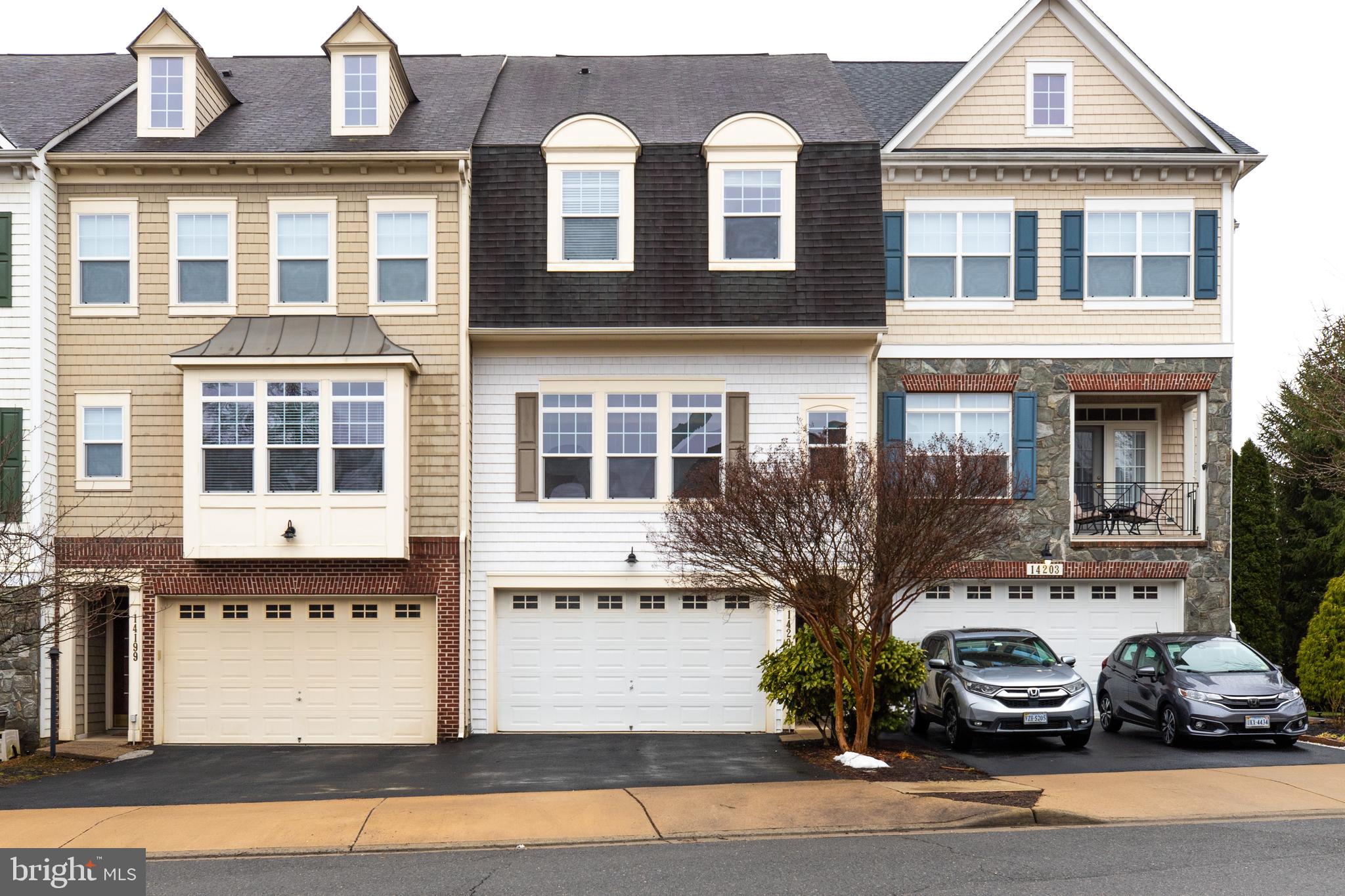 Over 2400sq, 3eds 3.5baths 2-car garage townhome, Back to open/common area/trees for a private setting. Gorgeous wood floors -all levels, stairs, UL open hall & foyer. Bright & neutral colors. Wonderful moldings and fixtures. Superior tile in kitchen backsplash and bathrooms. Lower Level Full Bathroom with rec. room fireplace & doors to the backyard. Deck * Soaking Tub * 2 car Garage * Covered Entry.