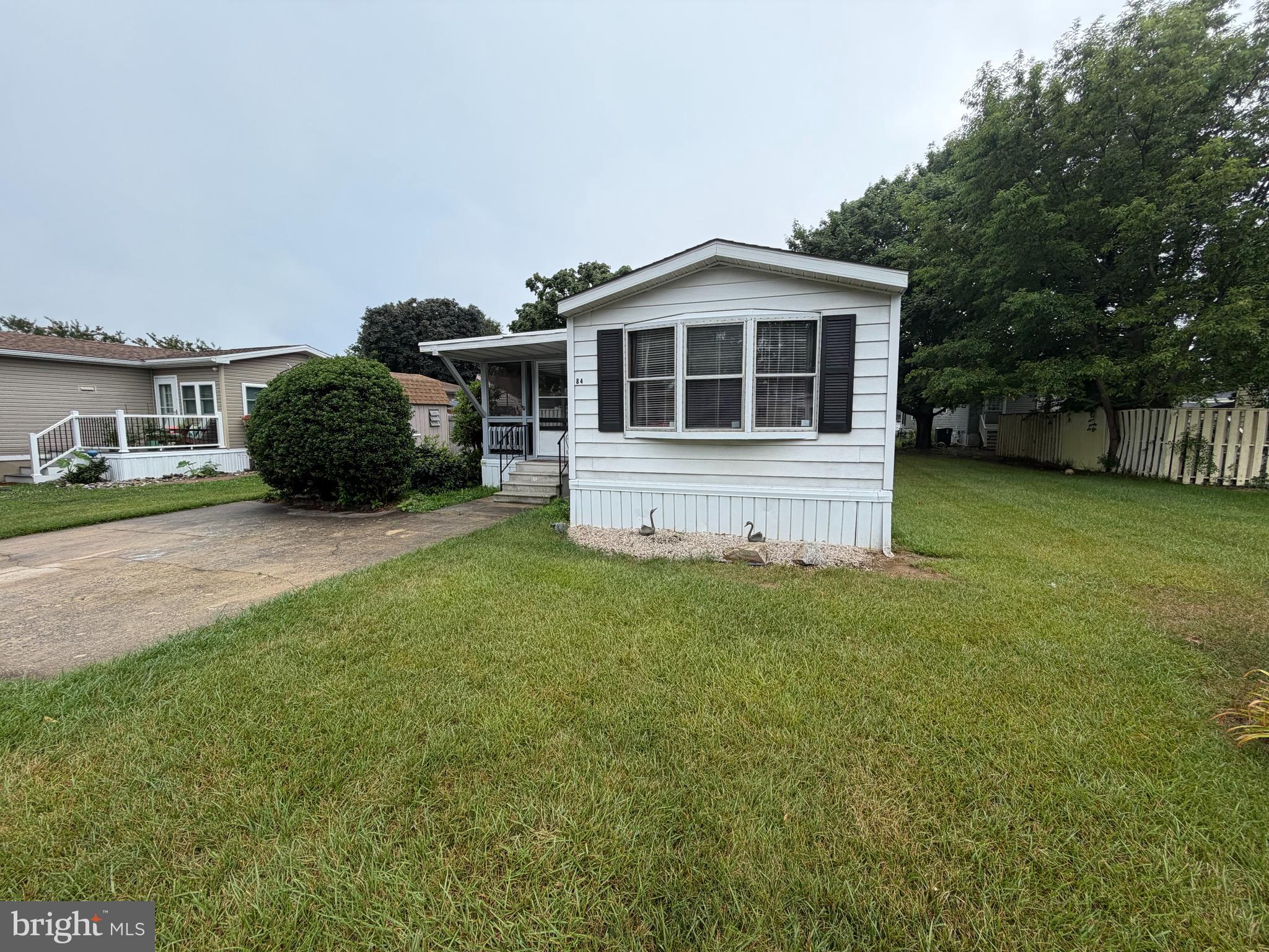 One of the best lots in the community sits only steps away from pool. Welcome to desirable Aspen Meadows, a well cared for community with amenities that include: trash/recycle, lawn service, and pool with fitness center. Location is superb as you are minutes away from Rehoboth beach and surrounded by shopping and dining. This 3 bedroom 2 full bath home has been wonderfully maintained and features newer hvac, roof, and water heater with an oversized deck and a huge screened in porch. Schedule your tour today and soon enough you could be relaxing in the beach town of Rehoboth Beach. Perfect for year-round living or a turnkey beach getaway. Photos coming soon. Buyers must be approved for community.
