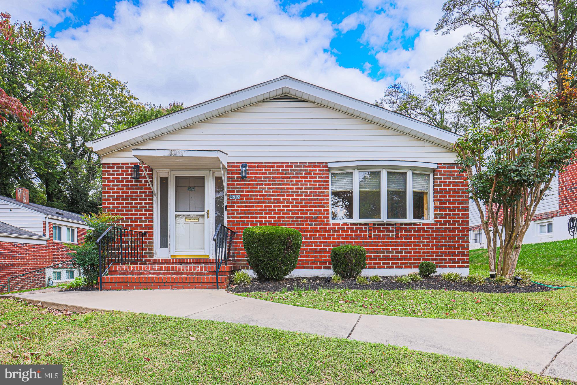 Expanded 6 bedroom 3 bath brick split level.  5 bedrooms all on upper level with 3 updated full bathrooms,    Large combo living room-dining room, spacious eat in kitchen, wooden deck, level yard.  Finished lower level with family room, 6th bedroom, laundry room.  Chandelier Excluded