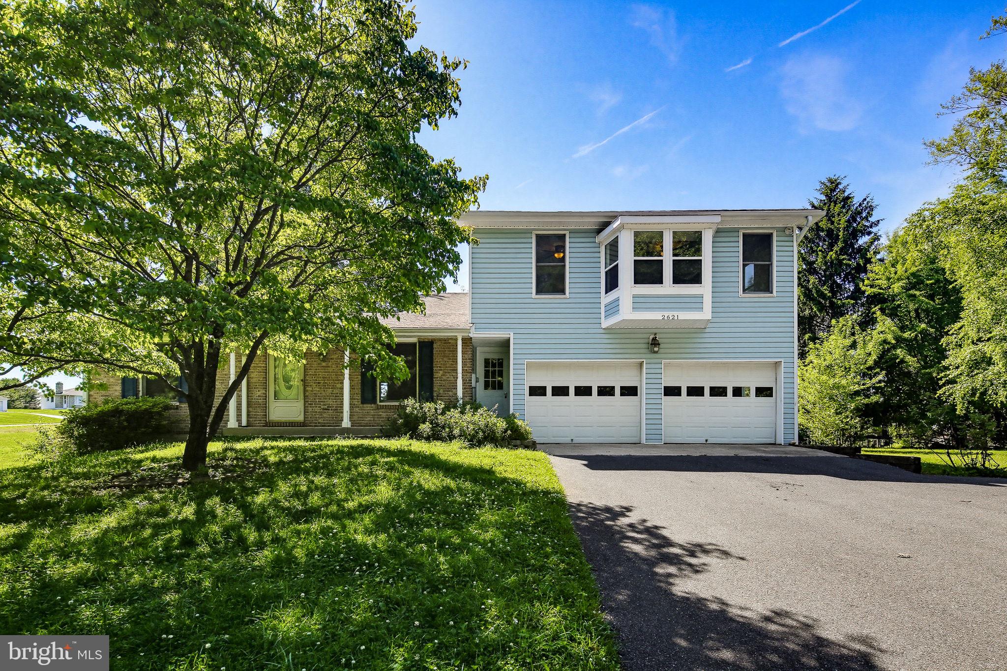 Welcome to this beautiful 4-bedroom, 2-full-bath home, perfectly situated on over an acre of picturesque, landscaped grounds offering space, privacy, and endless possibilities. From the moment you arrive, you'll appreciate the charming setting and inviting atmosphere this property provides.

Step inside to a bright and welcoming living room featuring hardwood flooring and an effortless flow into the formal dining room, where sliders lead to a spacious deck overlooking the expansive backyard—perfect for outdoor entertaining, morning coffee, or simply enjoying the peaceful surroundings.

The main level offers two generously sized bedrooms, including one with fresh paint and brand-new carpeting, along with a full bath featuring a tub/shower combination. The eat-in kitchen is well-equipped with a double wall oven, electric cooktop, ample cabinetry, and plenty of space for casual dining. Just off the kitchen, a flexible bonus room provides the perfect home office, playroom, or potential fifth bedroom.

Upstairs, retreat to the impressive primary suite, a true private sanctuary featuring a spacious sitting area highlighted by a beautiful bay window, two walk-in closets, and three ceiling fans for year-round comfort. An additional large bedroom and a stunning full bath with a vaulted ceiling, soaking tub, and separate walk-in shower complete the upper level.

The walk-out lower level offers incredible potential with a spacious family room, an additional bonus room ideal for a home gym, hobby space, office, or potential sixth bedroom, plus a rough-in for a future full bath. Whether you're looking for additional living space or room to customize, this level provides endless opportunities.

With its versatile floor plan, abundant living space, and beautiful acreage, this exceptional property offers the perfect blend of comfort, functionality, and future potential. Don't miss the opportunity to make this wonderful home your own!
