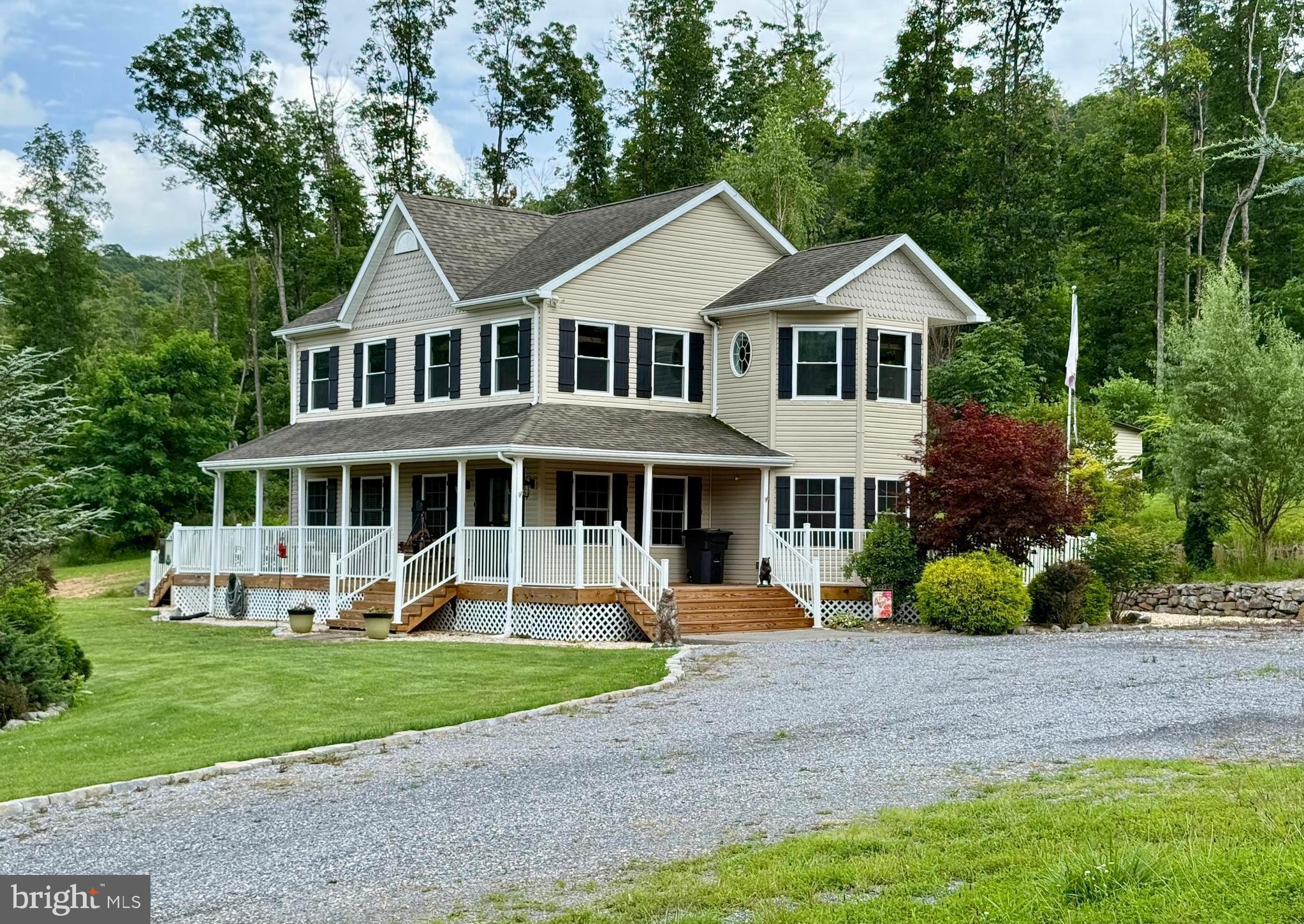 Nestled in a serene countryside setting, this beautiful property offers the perfect blend of comfort, space and rural charm.  The centerpiece is a spacious two story farmhouse with a 360 degree, wrap around porch-ideal for relaxing and enjoying the tranquil surroundings.  The gently rolling unrestricted, 8 acres includes lush open fields and a peaceful wooded backdrop, along with a scenic pond near the edge of the forest-creating a truly picturesque retreat.  

Step inside to a world of warmth and elegance in this exquisite 2050+/- sq. ft. home, where every detail has been thoughtfully crafted to elevate your living experience. The heart of this home is undoubtedly the gourmet kitchen, a culinary enthusiast's dream come true. Rich, honey-toned wooden cabinets stretch from floor to ceiling, providing ample storage and exuding a timeless charm. The sleek stainless-steel appliances, including a built-in microwave and modern range, offer both style and functionality. A stunning backsplash adds a touch of sophistication, while the gleaming floors tie the space together beautifully.

As you move through the home, you'll discover a harmonious blend of comfort and style in every room. The living areas are bathed in natural light, creating an inviting atmosphere perfect for both relaxation and entertaining with a stone gas fireplace being the focal.  Ceiling fans throughout ensure year-round comfort, while the carefully chosen decor adds personality and warmth to each space.

The bedrooms are sanctuaries of tranquility.  The oversized primary bedroom includes a setting/gym/office space.  Completing this area is a walk-in closet & primary bath.  Ample windows offer serene views and fill the rooms with soft, natural light. The bathrooms are modern oases, featuring stylish vanities, ample storage, and unique design elements like the striking accent wall that adds a touch of luxury to your daily routine.

One of the home's most charming features is its welcoming entryway. A beautiful stained glass door creates a stunning first impression, while the combination of beautiful floors and large windows sets the tone for the warmth that permeates throughout the house.

With three bedrooms, three bathrooms, and additional spaces like an office and laundry room, this home offers the perfect balance of shared and private areas. The open concept living and dining area is ideal for hosting gatherings, while the separate rooms provide quiet retreats when needed.

Plenty of storage space is found in the floored attic accessed by stationery steps. 

Step outside to a landscaped yard featuring a custom-built fire pit, perfect for entertaining under the stars.

Complementing the home is a 40' x 40',  well maintained detached metal garage with dual garage doors, offering abundant space for a workshop, storage or a hobby area.  A full house generator will convey.

Located at 1809 Caldwell Hollow Rd in the picturesque setting this property offers not just a home, but a lifestyle. Imagine waking up each morning in this beautifully appointed space, ready to embrace all that life has to offer. This isn't just a house - it's the canvas upon which you'll paint the memories of a lifetime.  Whether you're looking for a full-time residence, a family getaway, or a place to build your dream lifestyle, this property delivers space, functionality, and natural beauty in equal measure.