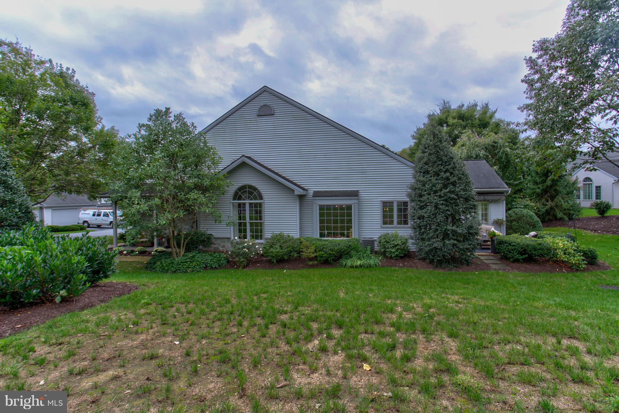 Large open floor plan one floor living in private setting of Manheim Township's Deer Ford community on private drive. Home features Brazilian cherry hardwood floors, crown molding throughout, granite kitchen with tile backsplash, pull out shelves in pantry and tons of storage, handicap shower and whirlpool tub in bathroom, large windows allow for plenty of natural light, beautiful sunroom and 2 patios. Park like landscaping and convenient location.
