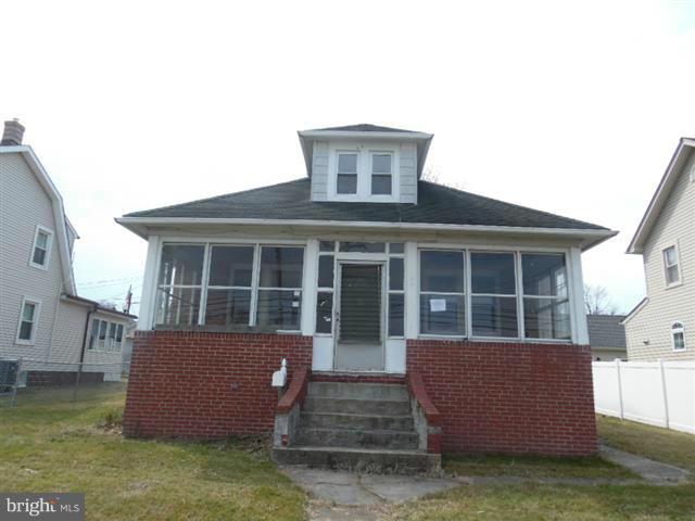 Spacious Cape Cod in Edgemere features Enclosed front , rear and side porches. Partially fenced rear yard with detached 2 car garage. Two bedrooms on main level with full bath. Formal L.R. & D.R. and huge country kitchen.Upper level has 2 nice size bedrooms with play area or library .Full lower level with laundry and flush. Close to schools and shopping. Easy access to Key Bridge & 695.
