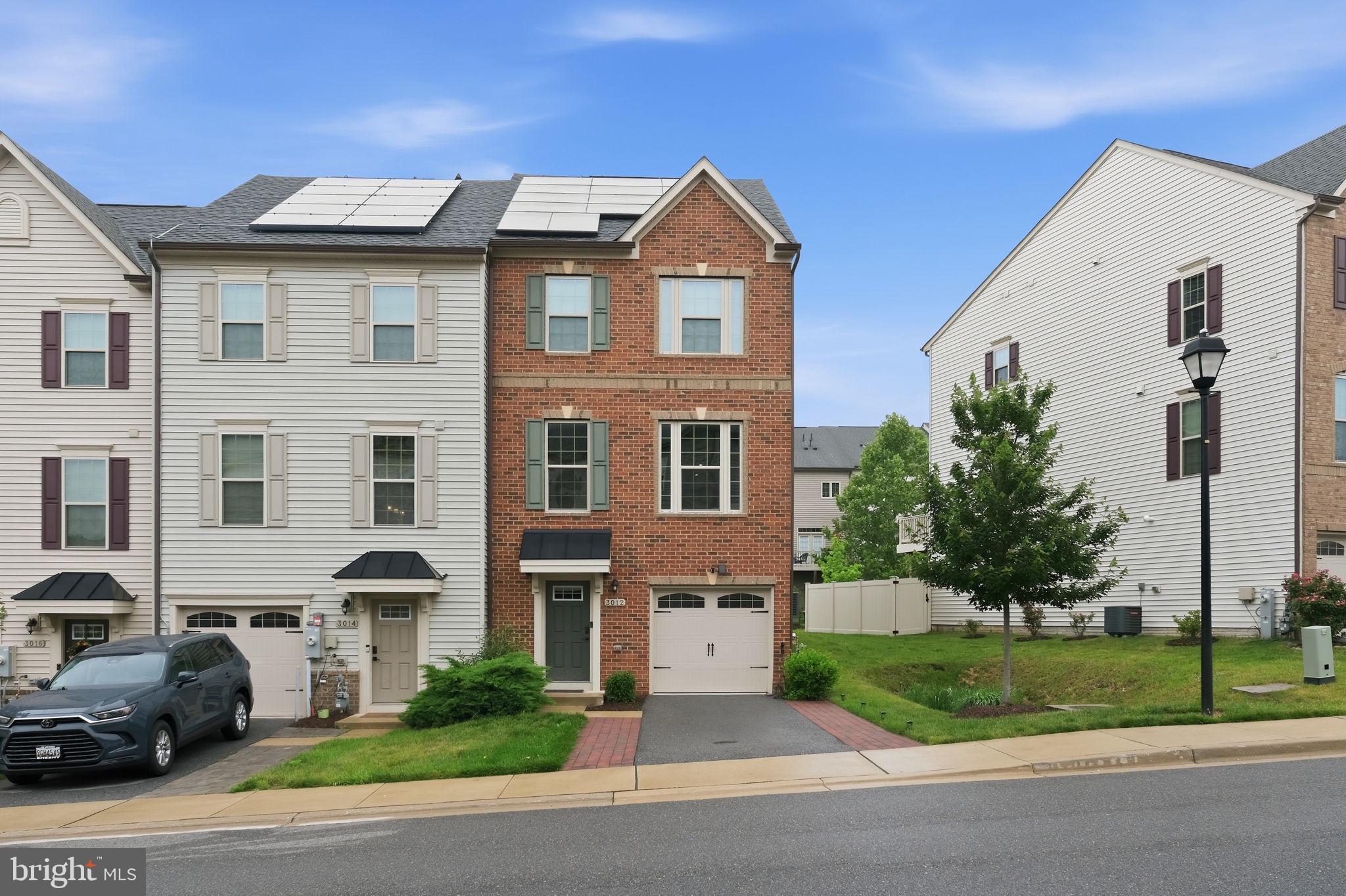 Welcome to 3012 Bretons Ridge Way, a beautifully maintained end-unit townhome in the sought-after Hanover area offering 4 finished levels, modern upgrades, and multiple outdoor living spaces. This spacious home features 4 bedrooms, 3.5 bathrooms, a 1-car garage, and both a private balcony and rooftop deck, perfect for entertaining or relaxing outdoors. The attached garage is equipped with a dedicated electric vehicle (EV) charging outlet, providing a convenient and cost-effective charging solution for current and future EV owners.

The entry level offers direct access from the garage and a versatile recreation room ideal for a home office, gym, or additional living space. The main level features luxury vinyl plank flooring throughout the open-concept layout, including the living room, dining area, and gourmet kitchen complete with quartz countertops, stainless steel appliances, ample cabinetry, and access to the private deck.

The third level includes the spacious primary suite with a walk-in closet and en-suite bathroom, along with two additional bedrooms, a full hallway bathroom, and conveniently located laundry. The top level offers a private fourth bedroom, full bathroom, and access to the rooftop deck with elevated views.

The home also includes fully paid-off solar panels, providing energy efficiency and long-term savings on utility costs without the expense of assuming a solar lease or loan. 

The HOA fee includes lawn maintenance as long as the backyard remains unfenced, offering low-maintenance living. Enjoy all that the amenity-rich Parkside community has to offer, including a clubhouse, outdoor pool, fitness center, jogging and walking trails, tot lots, playgrounds, community parks, sidewalks, snow removal, and professionally maintained common areas. Conveniently located near Arundel Mills Mall, Maryland Live! Casino, Fort Meade, BWI Airport, and major commuter routes including I-295, Route 100, and I-95. Nearby public transportation options include the Dorsey MARC Train Station and local bus routes for easy commuting into Baltimore, Annapolis, and Washington, DC. Enjoy close proximity to shopping, dining, entertainment, and everyday conveniences.