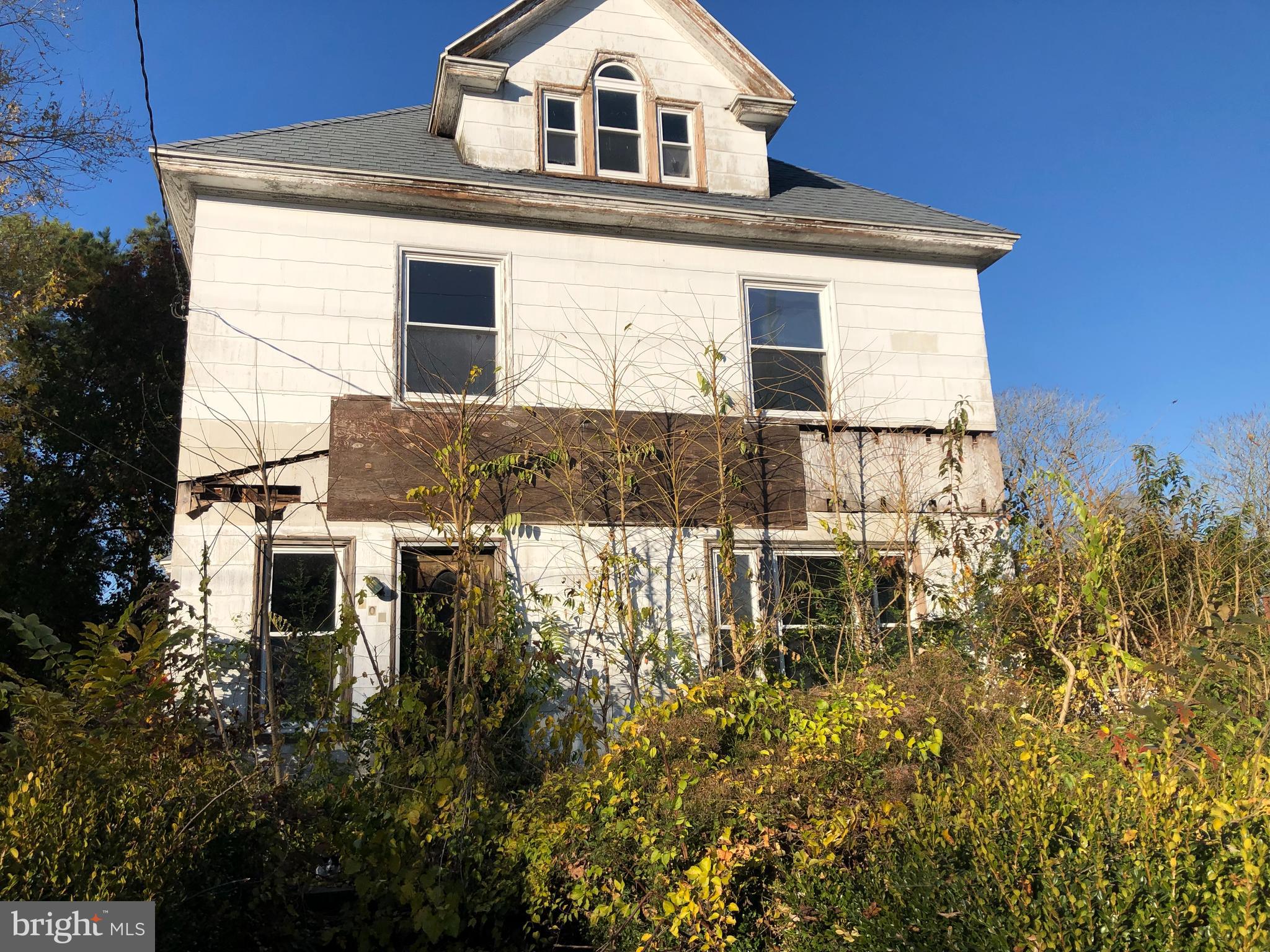 This victorian has been waiting for someone to revive it. Comes complete with everything that is currently inside it as well. Has had a roof and new windows in it's most recent history to protect it from the weather! 
It currently sits on one lot and has additional lot as well, both deeded together.