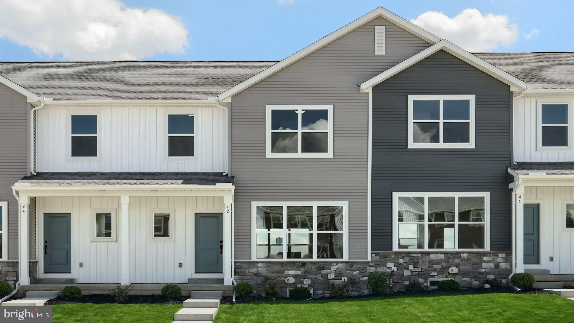 This charming 2-story townhome includes a 1-car, rear load garage, 9’ ceilings on the first floor, and a composite deck. Stylish vinyl plank flooring flows throughout the first floor. The foyer opens to an elegant dining room that also has access into the kitchen. The kitchen, well-appointed with stainless steel appliances and quartz countertops, opens to the sunny, spacious family room. On the second floor, the owner’s suite features an expansive closet and a private bathroom. Adjacent to the suite are two additional bedrooms, a full bathroom, and a laundry closet. Images may include virtual furnishings for illustrative purposes only.