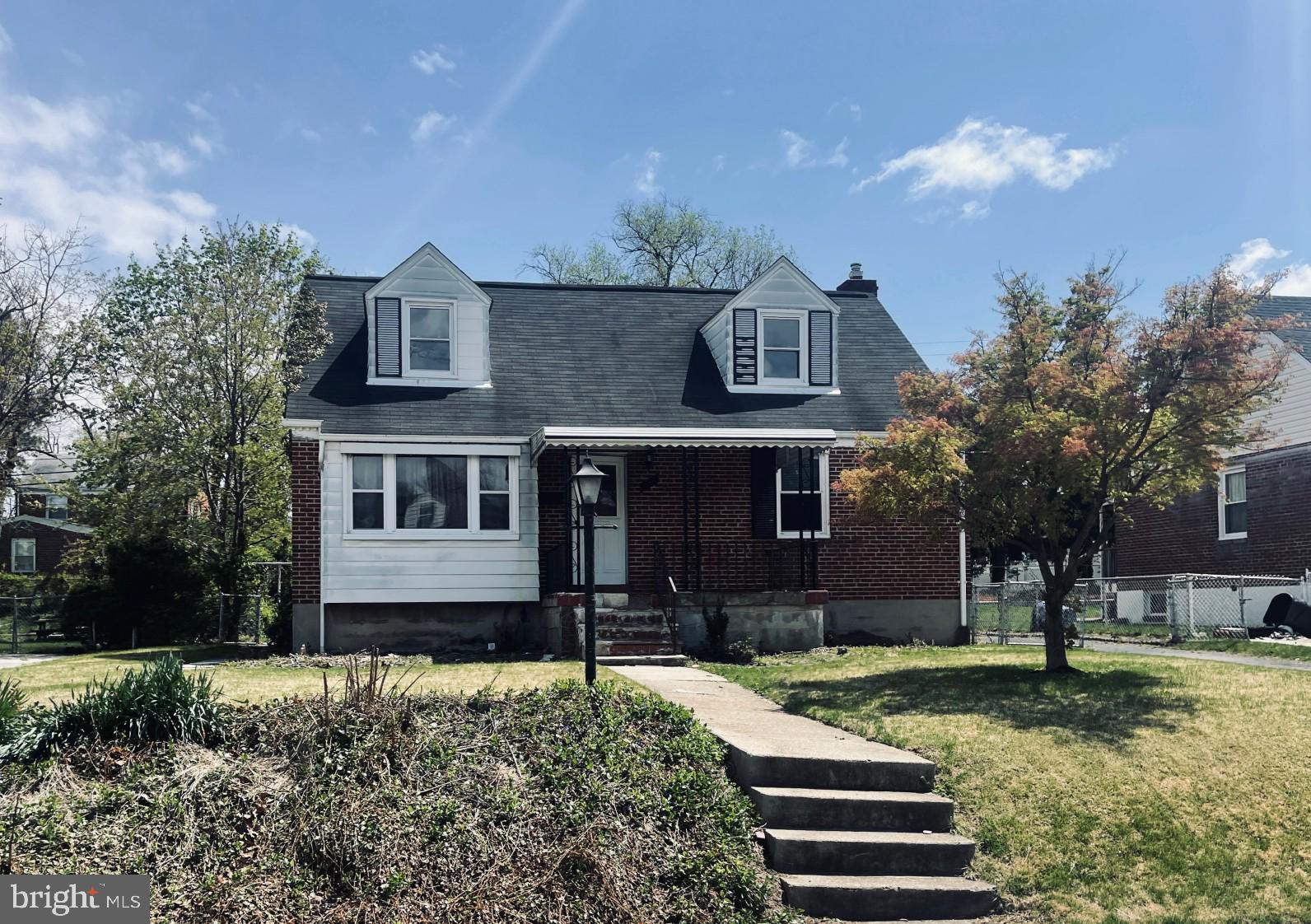 Don't miss this wonderful opportunity to own this solid brick frontporch home in the neighborhood of Milford Gardens.  Upon entry, you will be welcome with an open floor plan with hardwood floors, formal living room and dining room, nice sized kitchen, a full bath, and two large bedrooms with   built-in closets & ceiling fans.  Upper level has 2 more bedrooms and a full bath. The finished basement showcases family room with bar, another room that be converted as a den or another bedroom. The deck and wide yard at the rear is great for outdoor entertainment.