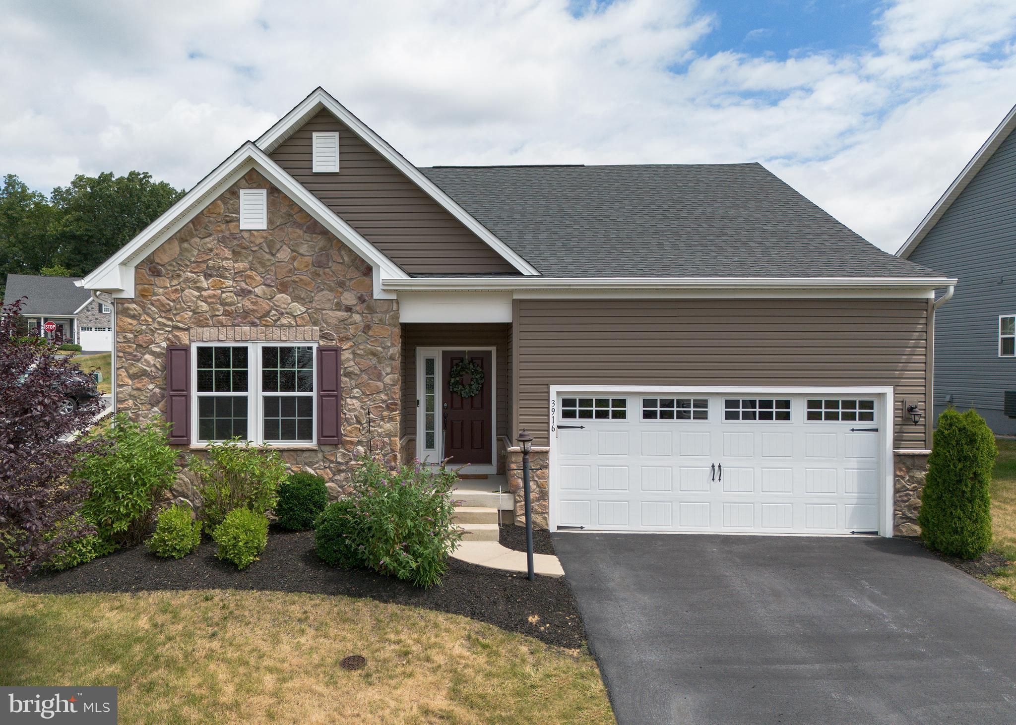 Welcome home to this stunning like new home on a corner lot in a quiet neighborhood.  Upon entering the home you will love how the rooms are filled with natural light and 9' foot ceilings throughout, make the space feel very spacious.  The kitchen boast a large granite island perfect for entertaining and cooking.  Enjoy the ease of first floor living with an oversized primary bedroom and bath with an oversized walk in closet.  The home features an in home office/sitting room and an additional bathroom perfect for guest or family.    The lower level has a large family room an additional bedroom and full bath.  Located off the dining room is a great patio and fenced in yard perfect for enjoying the summer.  This home offers many upgrades and features not to be missed.  This is a maintenance free living community, lawn care, landscaping and snow removal included in the HOA.   The only thing missing is you!  Welcome home