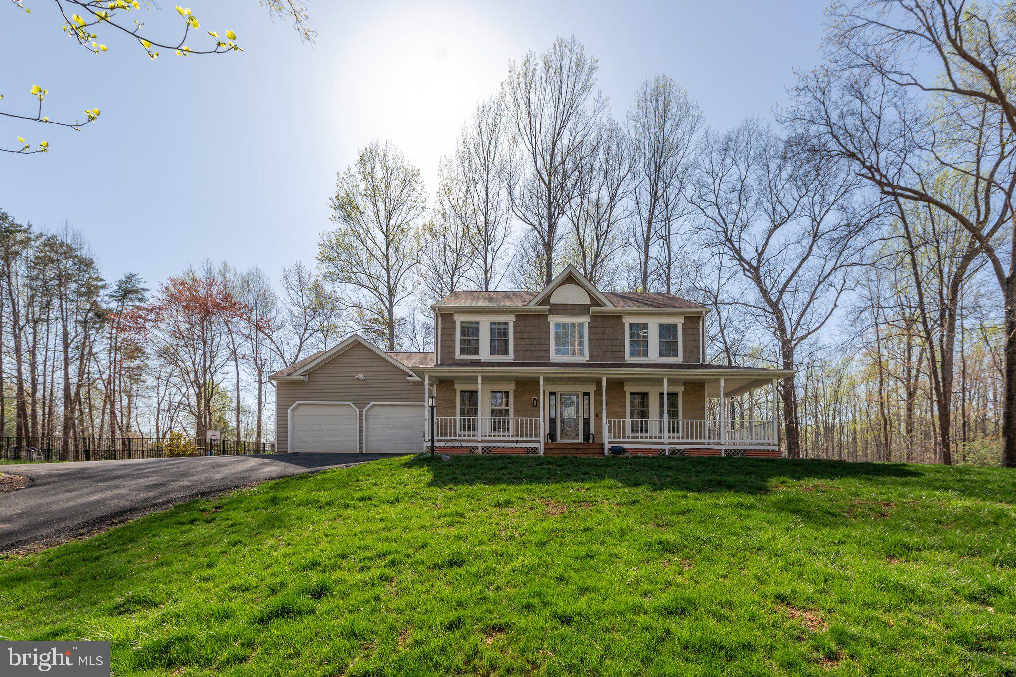 Private Retreat in Harwill Acres at 153 Harwill Drive in Stafford County.   

Nestled on over 3  acres of partially wooded land in the sought-after Harwill Acres subdivision, this stunning home offers unmatched privacy and serenity. A picturesque setting welcomes you with a sprawling wrap around front porch.

Fresh paint throughout this home adds a neutral backdrop for your decor. Step inside to a beautiful center foyer, with refinished wood floors, flanked by a versatile living room or home office on the right and an elegant dining room on the left. The gourmet kitchen is a chef's dream, featuring a striking copper hood vent, brand-new gas stove, stainless steel appliances, a custom backsplash, and a bright breakfast area with charming banquette seating. A large pantry and a garage-entry mudroom provide ample space to customize to your needs.

The inviting family room is bathed in natural light, showcasing a lovely fireplace and custom ceramic floors that add warmth and character. A French door leads to the expansive screened porch, spanning the entire length of the home—an ideal spot for entertaining or relaxing. Step outside to a private oasis, complete with a walkway leading to your own pool and sport court.

Upstairs, the spacious primary suite boasts a remodeled en-suite bath with sliding barn doors and rustic elegance. Large windows on both corners offer treetop views, creating a tranquil retreat. Three additional generous sized bedrooms share a well-appointed hall bath, all providing spectacular views of the secluded lot.

The lower level is designed for recreation and relaxation, featuring a Rec Room with a built-in bar, wainscoting and accent wallpaper perfect for game nights or entertaining.  An exercise room with rubber mat flooring and a set of French doors opens to the side yard. A renovated full bath is located on the lower level with a walk-in shower, perfect for rinsing off after a workout or a dip in the pool. Additional storage and a utility room ensure organization and convenience.

Outdoor living is just as impressive, with a lush green front yard, a massive wrap-around porch, a fire pit, two play structures, an in-ground pool, a lighted sport court and a partially fenced backyard—all enveloped by mature trees for ultimate privacy. The long driveway offers abundant parking, complementing the front-load two-car garage. A convenient storage shed keeps tools and outdoor essentials neatly tucked away. If you've been dreaming of space, style, and endless fun, this is THE ONE. 

Stafford County, Virginia, located between Washington, D.C., and Richmond, boasts a growing population, a business-friendly environment, and a focus on preserving natural and historical resources, while also offering a variety of recreational opportunities and a good quality of life

This exceptional property is a rare gem, combining modern updates with rustic charm, abundant space, and breathtaking surroundings. Don't miss your chance to call 153 Harwill Acres home!