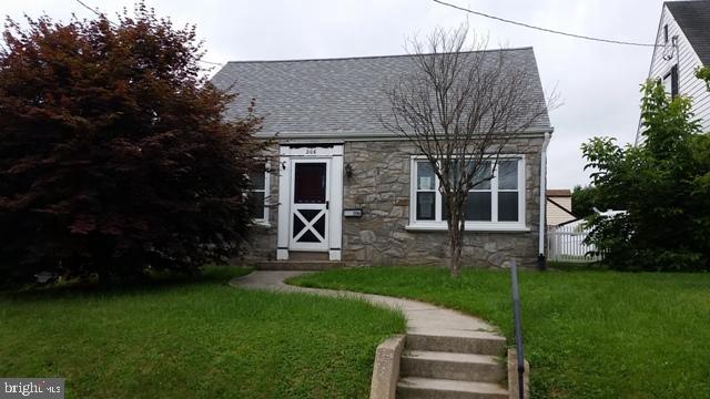 Stone Cape Cod with hardwood floors, updated kitchen and first floor bedroom. Second floor loft bedroom with built-in storage. Fenced yard and enclosed patio.
