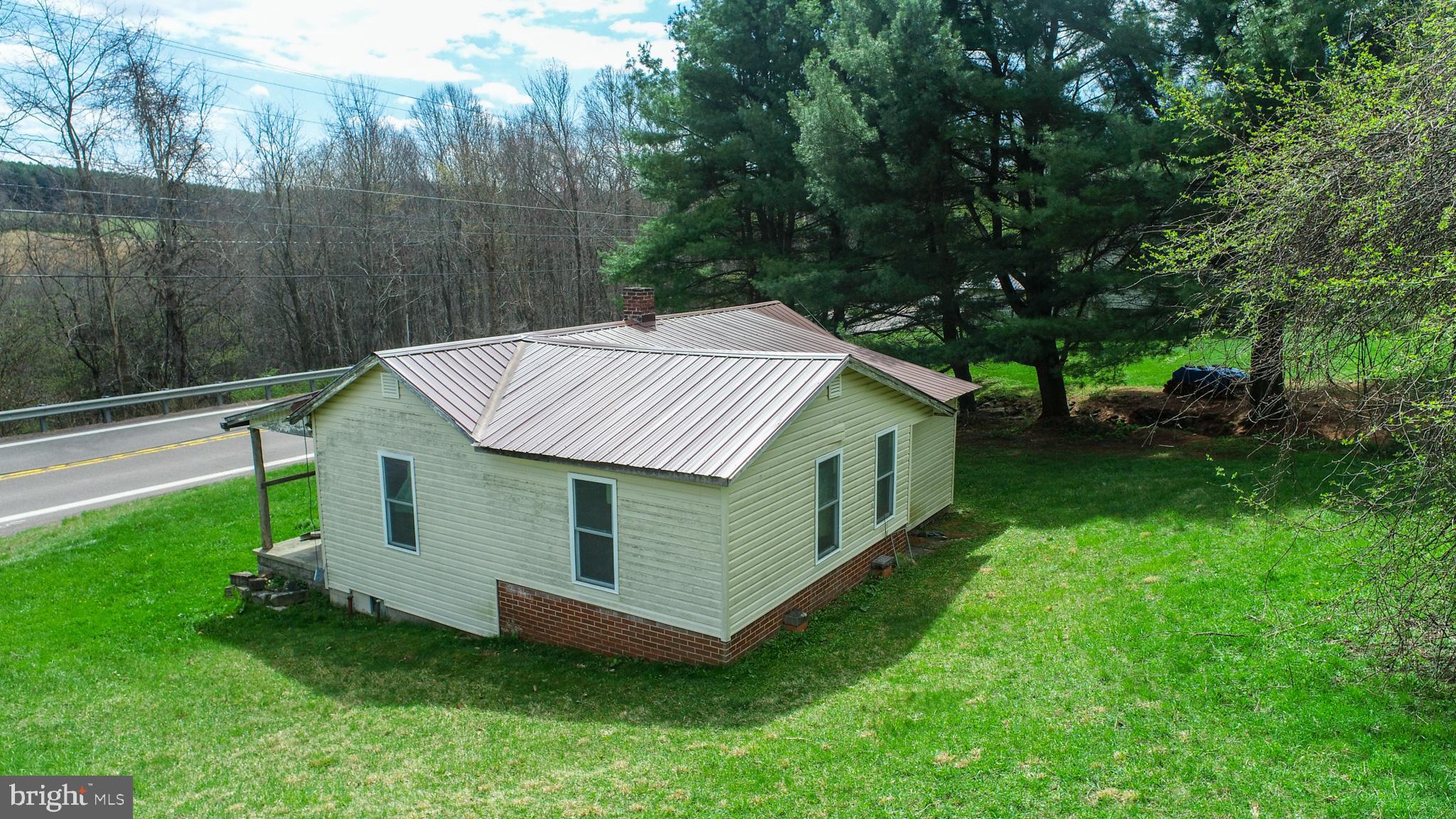 This 1950-built 2-bedroom, 1-bath home with 4 year old metal roof.  Interior  is primed for a full renovation . Property is 2.97 acres fronting a county maintained road..  Opportunity to purchase adjacent land.